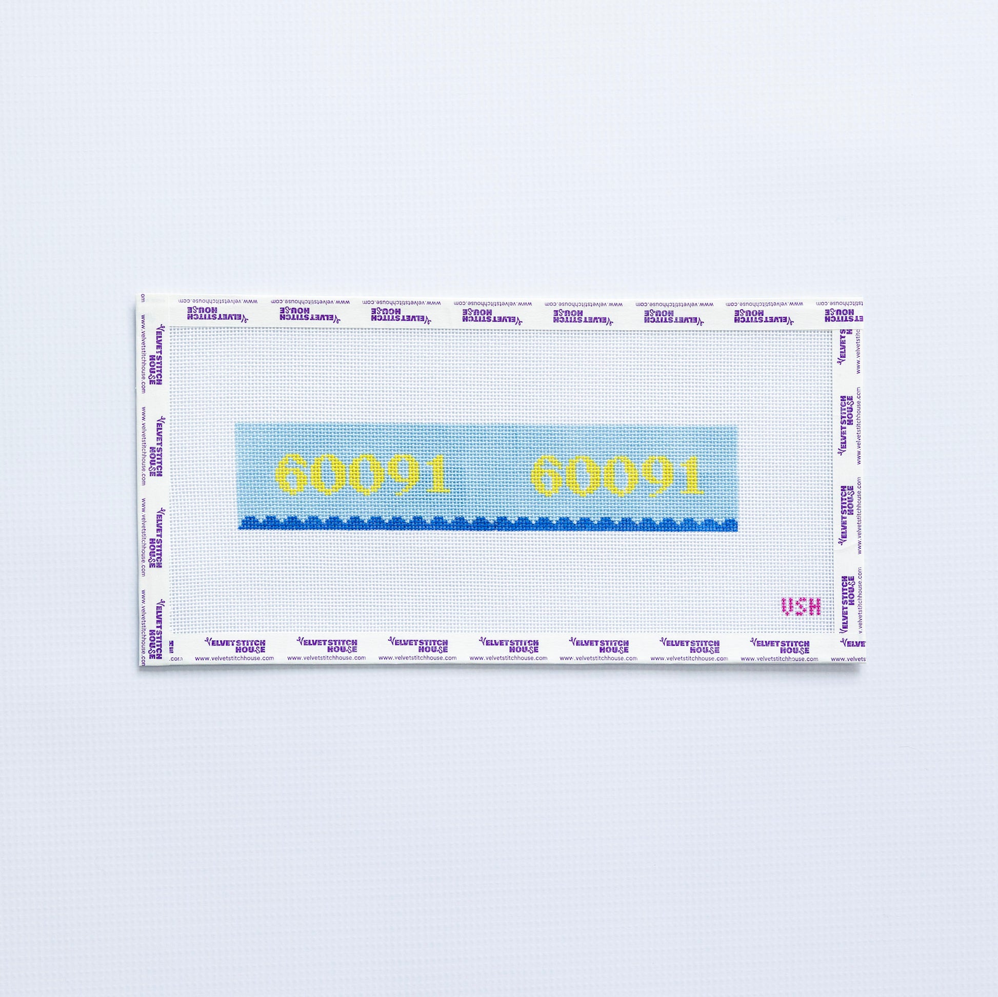 Needlepoint pattern key fob with 60091 zip code in yellow on a blue background with blue scallop edge. 