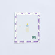 mini needlepoint pattern with cream colored baby bottle 