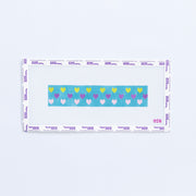 Needlepoint pattern key fob with multi color hearts on a teal background