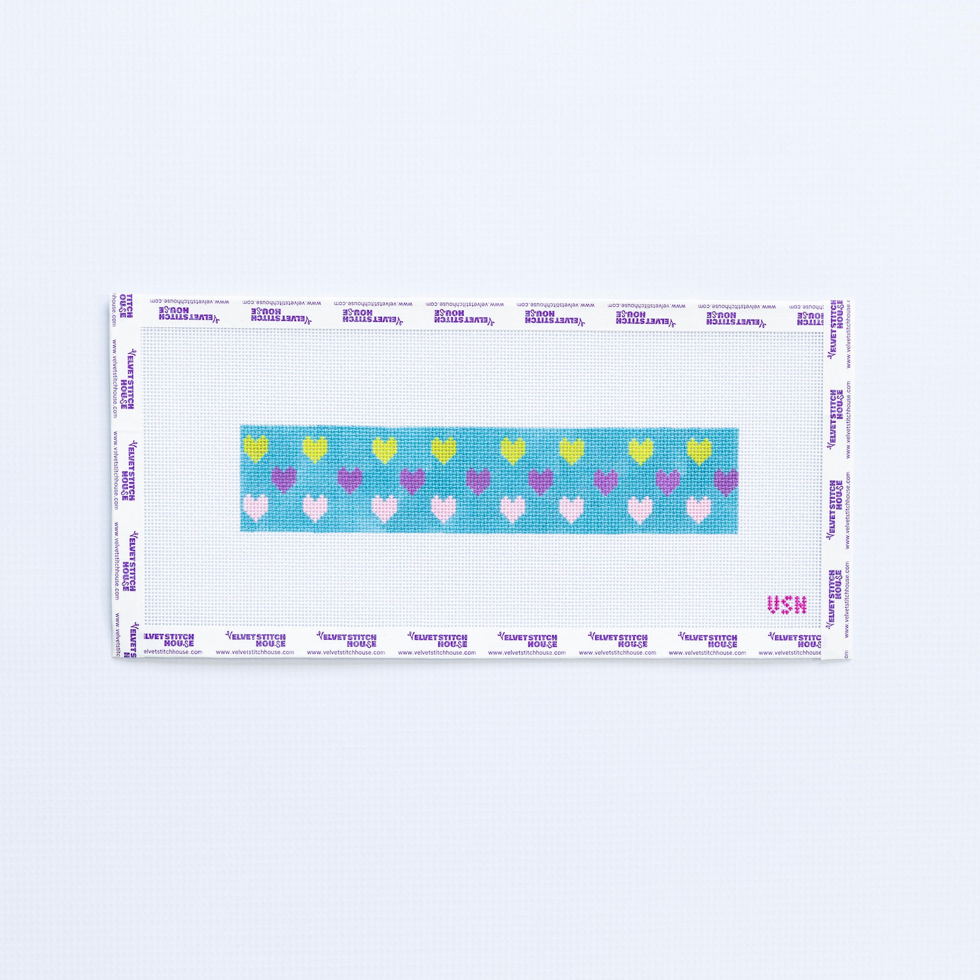 Needlepoint pattern key fob with multi color hearts on a teal background