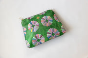 Green pouch with colorful floral pattern on a white background