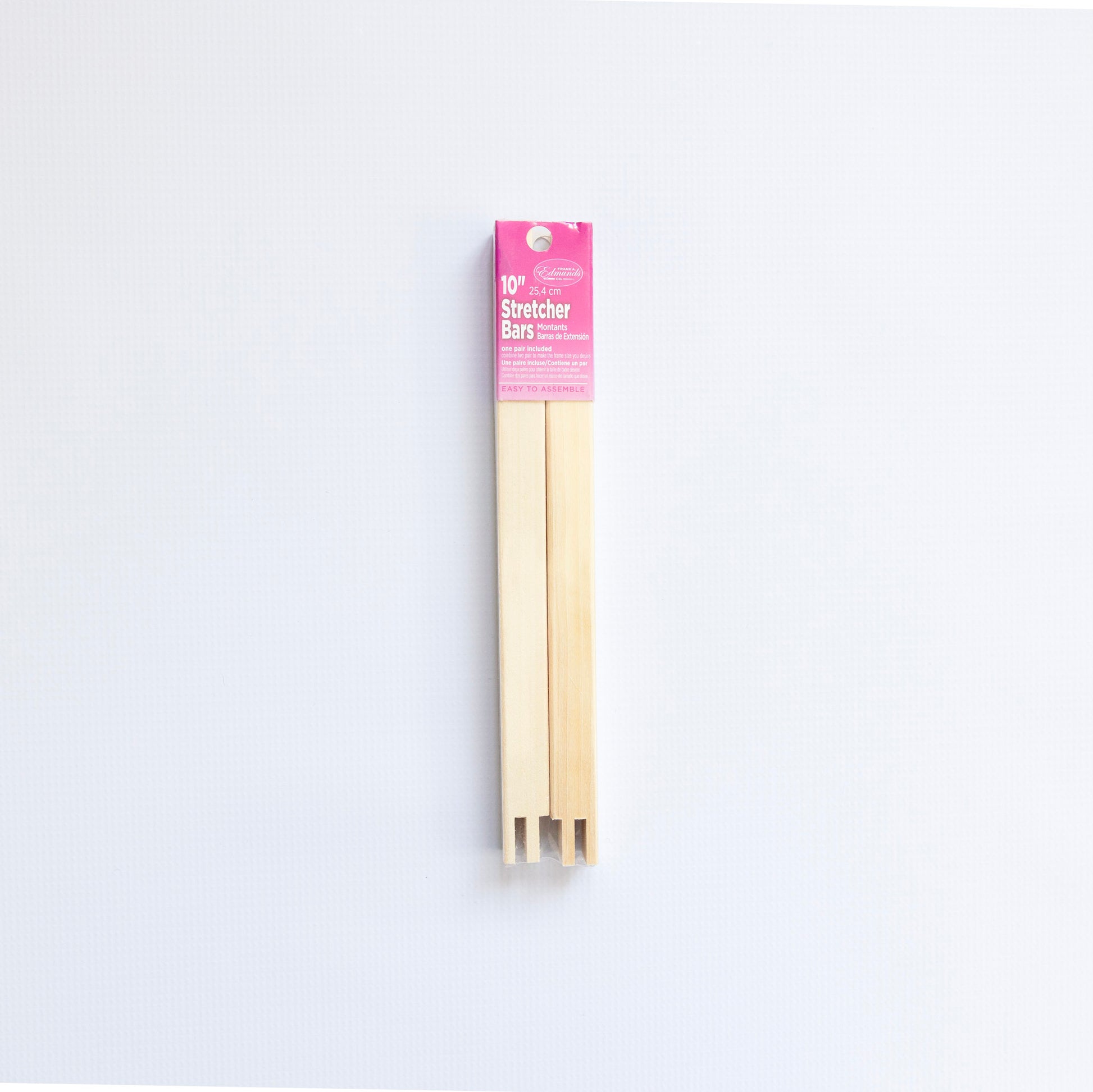 Pack of stretcher bars with pink label on a white background