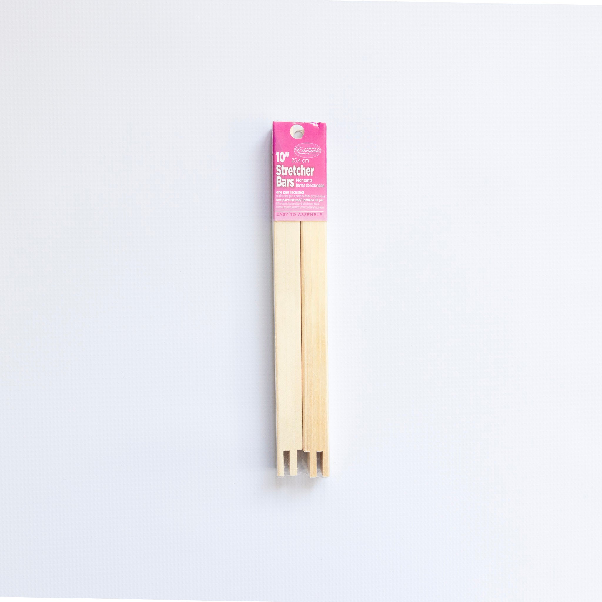 Pack of stretcher bars with pink label on a white background