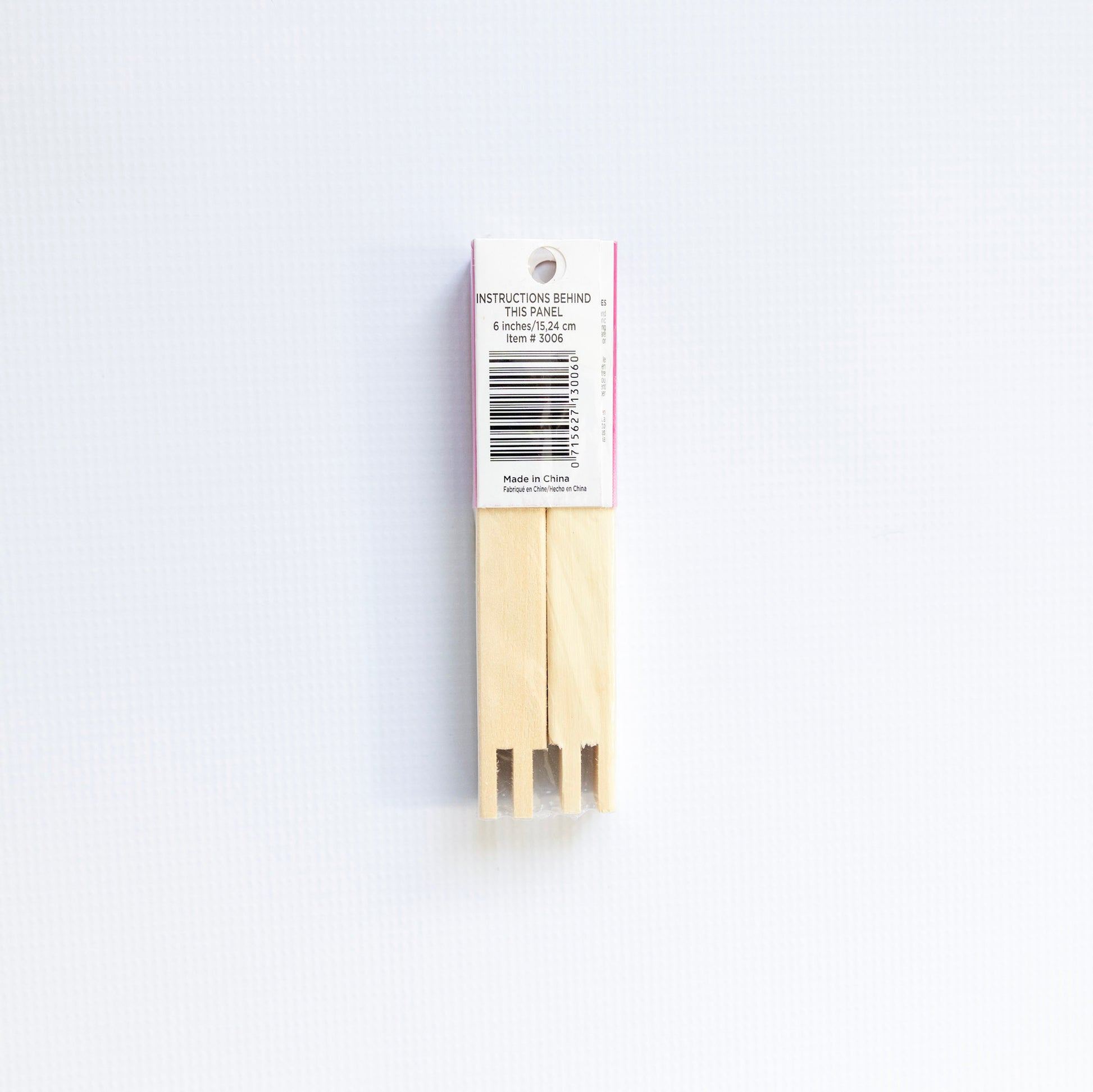 Pack of wooden toothpicks with a label on a white background