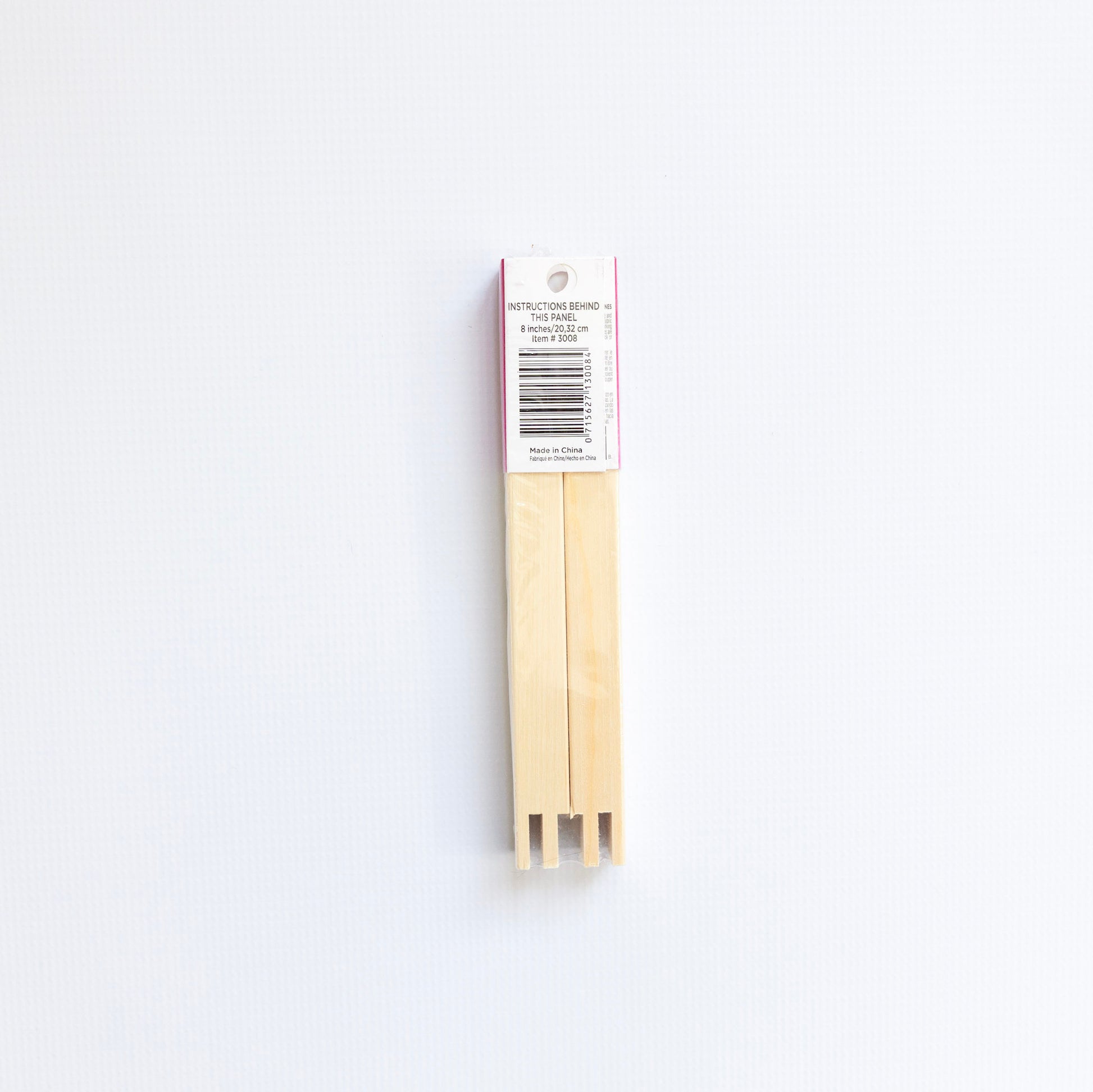 Two wooden stretcher bars on a white background