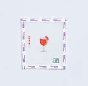 mini needlepoint pattern with orange aperol spritz on white background