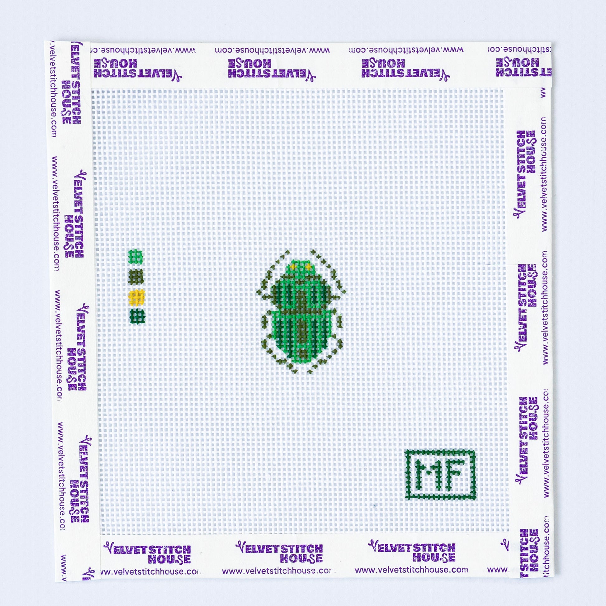 Needlepoint pattern of a mini green beetle.