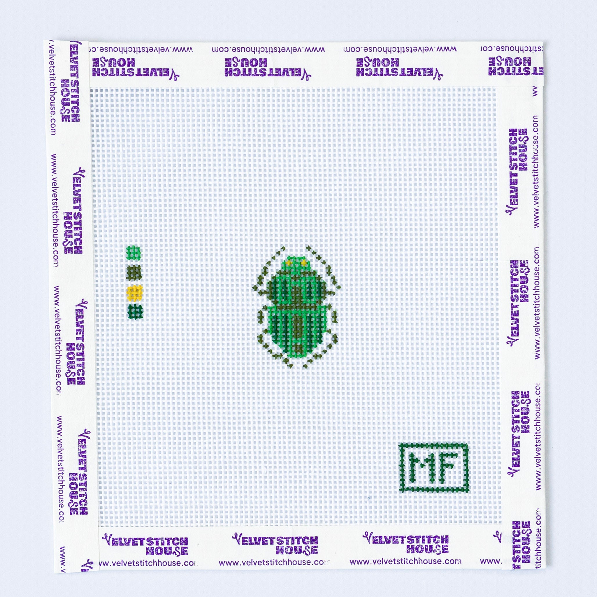Needlepoint pattern of a mini green beetle.