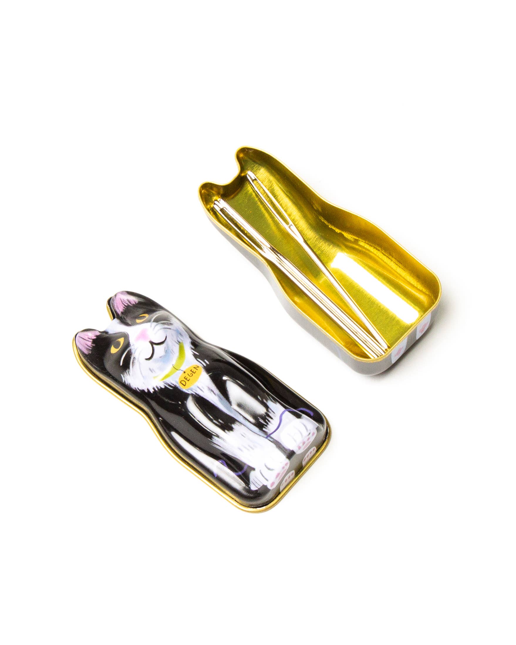 Cat-shaped needle case with a gold outline on a white background