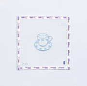 Needlepoint pattern with a teacup design on a white background