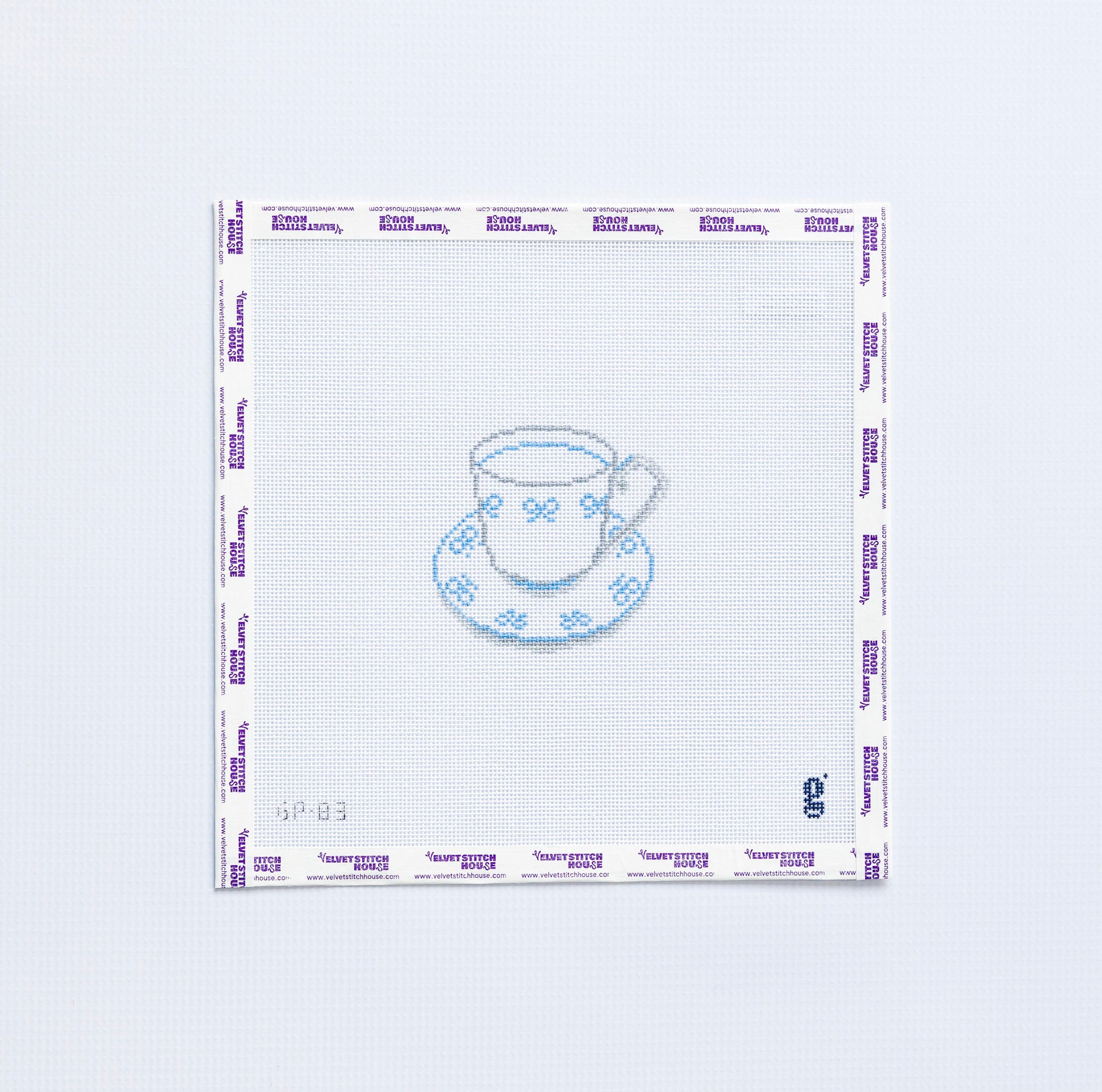 Needlepoint pattern with a teacup design on a white background