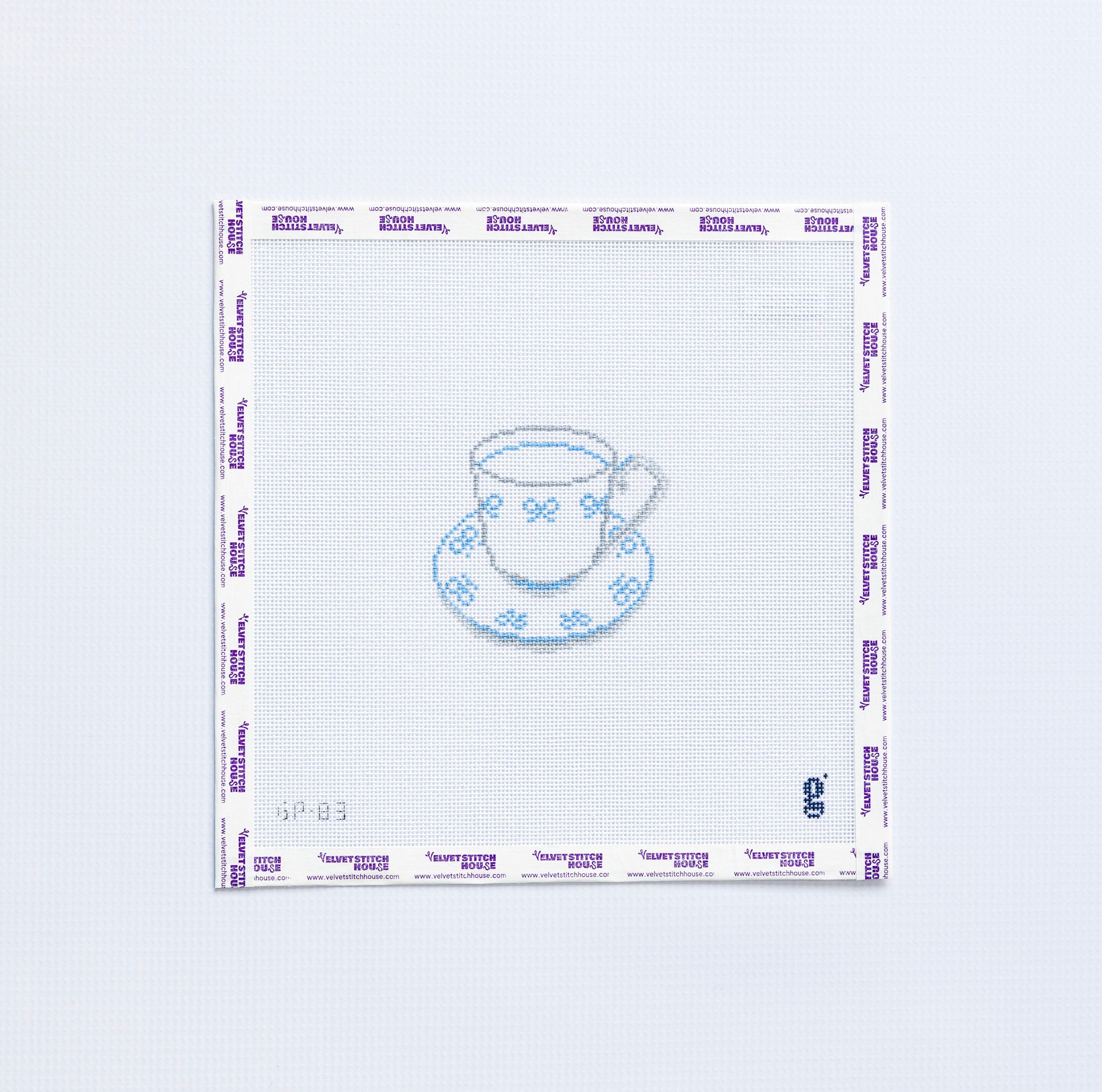 Needlepoint pattern with a teacup design on a white background