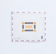 Needlepoint pattern with 'BOO!' text and pumpkins on a white background