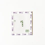 Needlepoint pattern with a green and white striped mini candy cane.