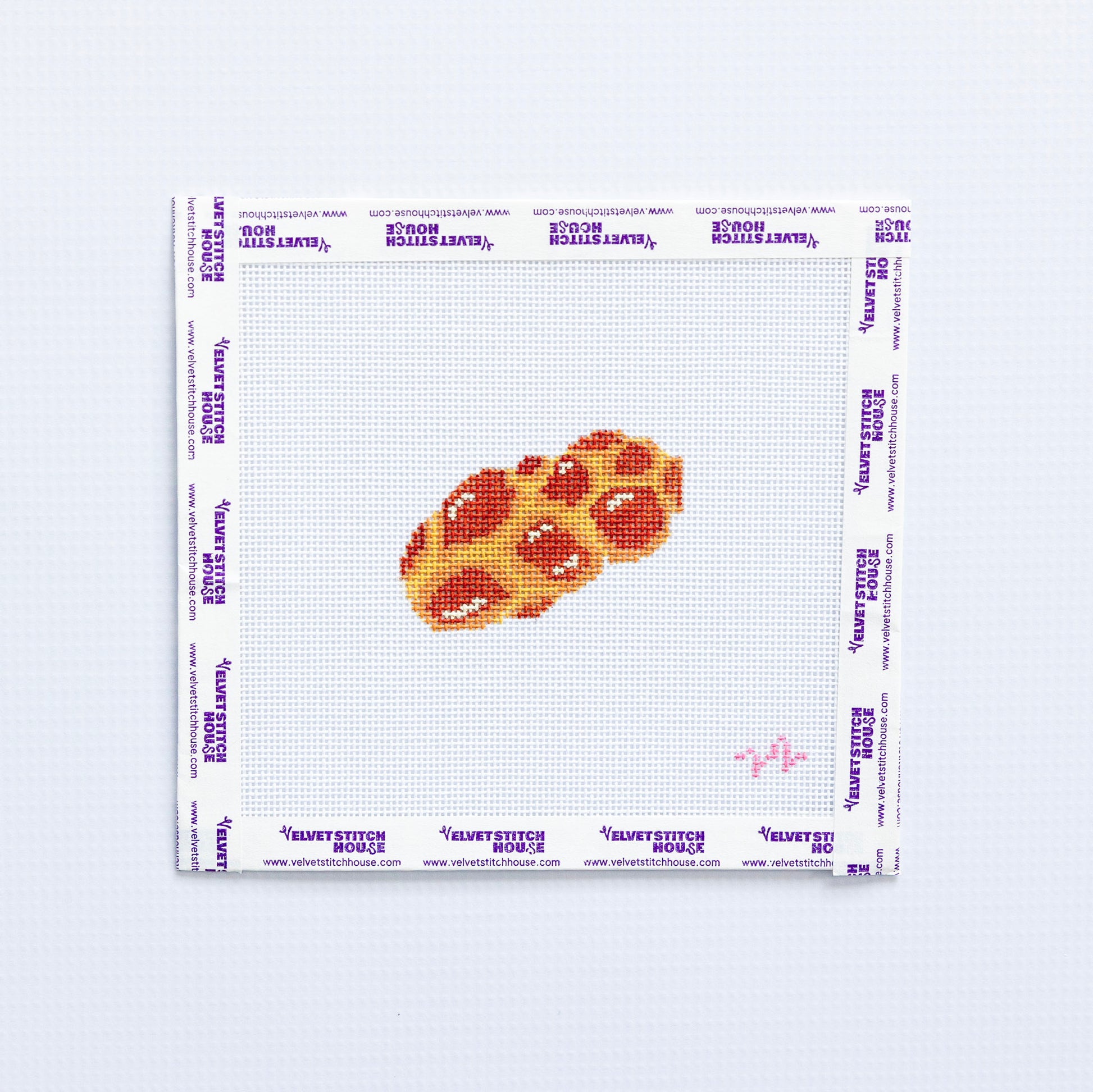 Needlepoint pattern of  challag on a grid with a white background