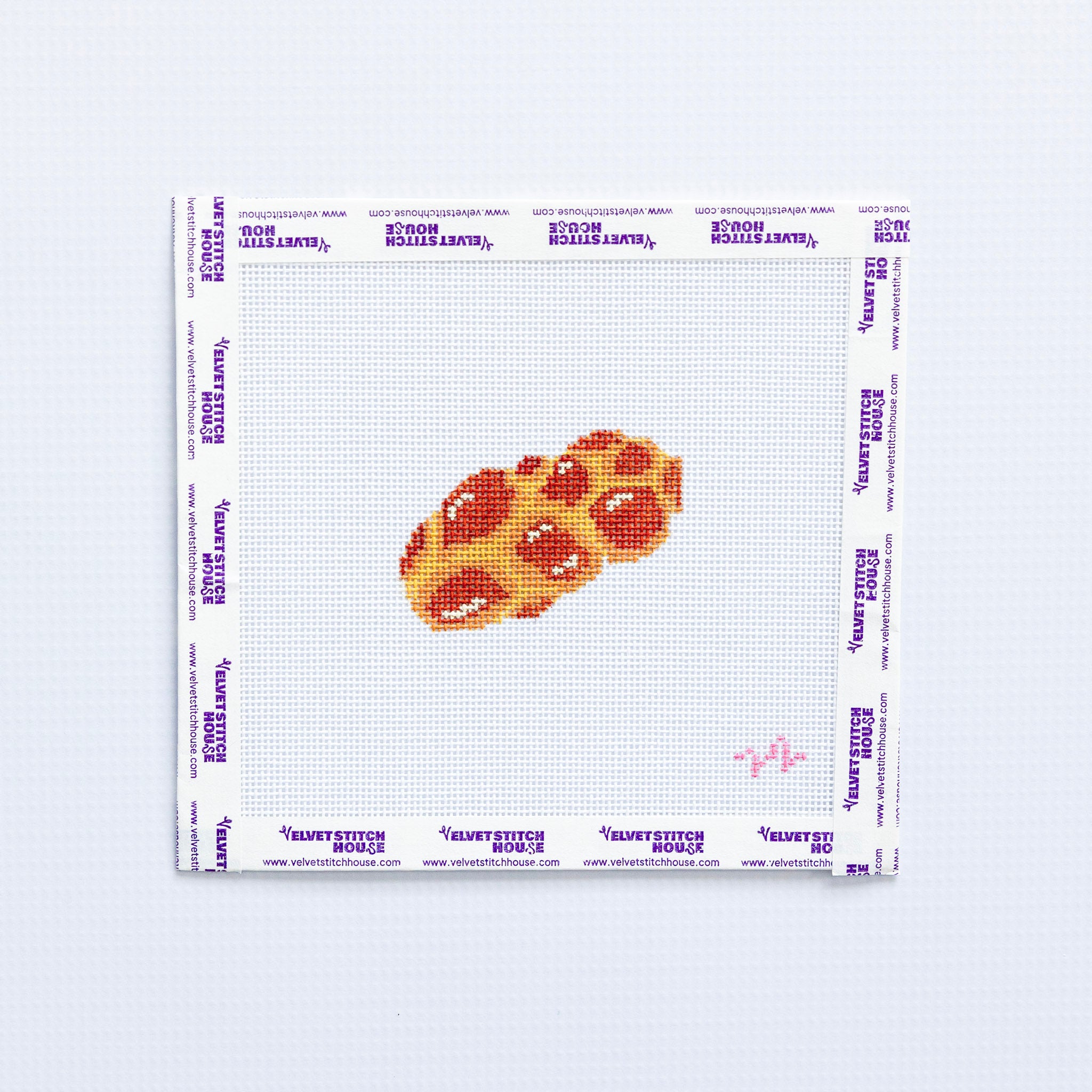 Needlepoint pattern of  challag on a grid with a white background