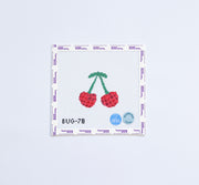 Needlepoint design of sparkly cherries
