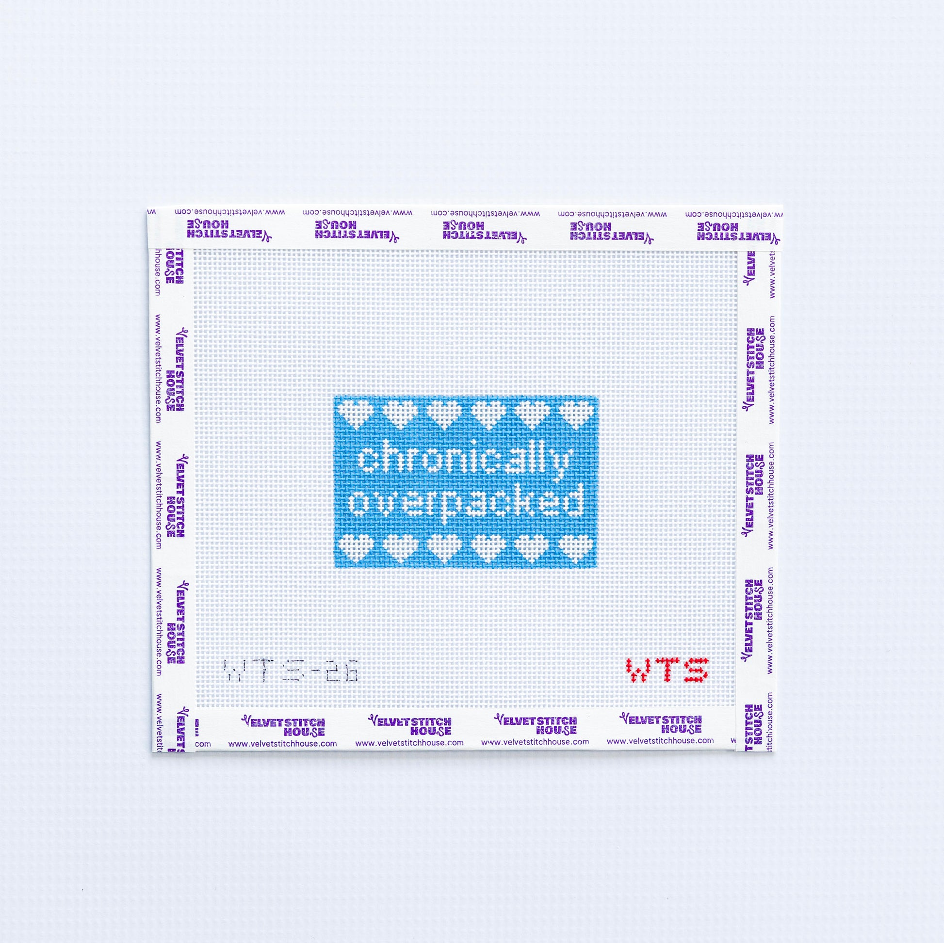 Needlepoint pattern with 'chronically overpacked' text and heart symbols on a white background