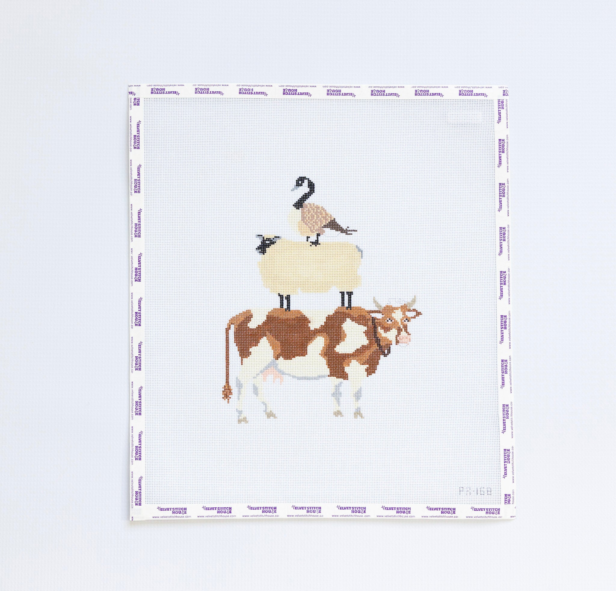 Needlepoint design of a cow, sheep, and goose on a white background.