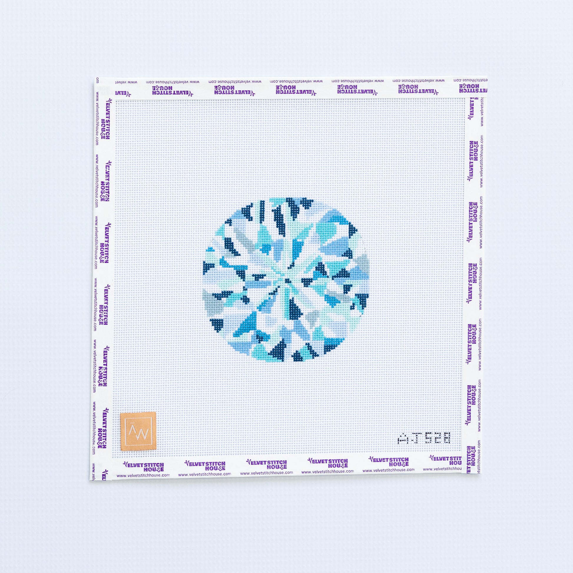 Needlepoint pattern of a blue and white diamond with a blue geometric design on a white background