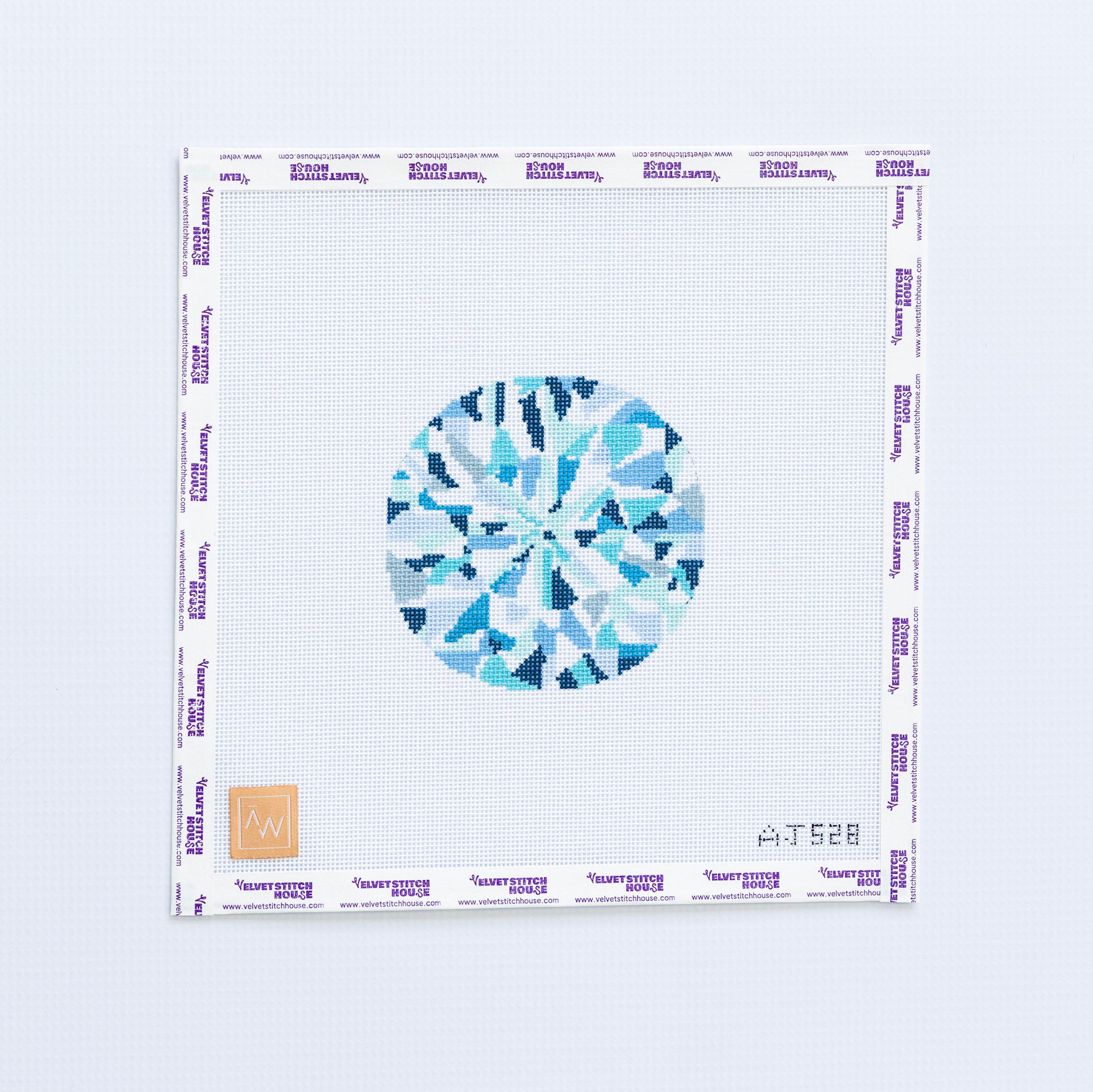 Needlepoint pattern of a blue and white diamond with a blue geometric design on a white background