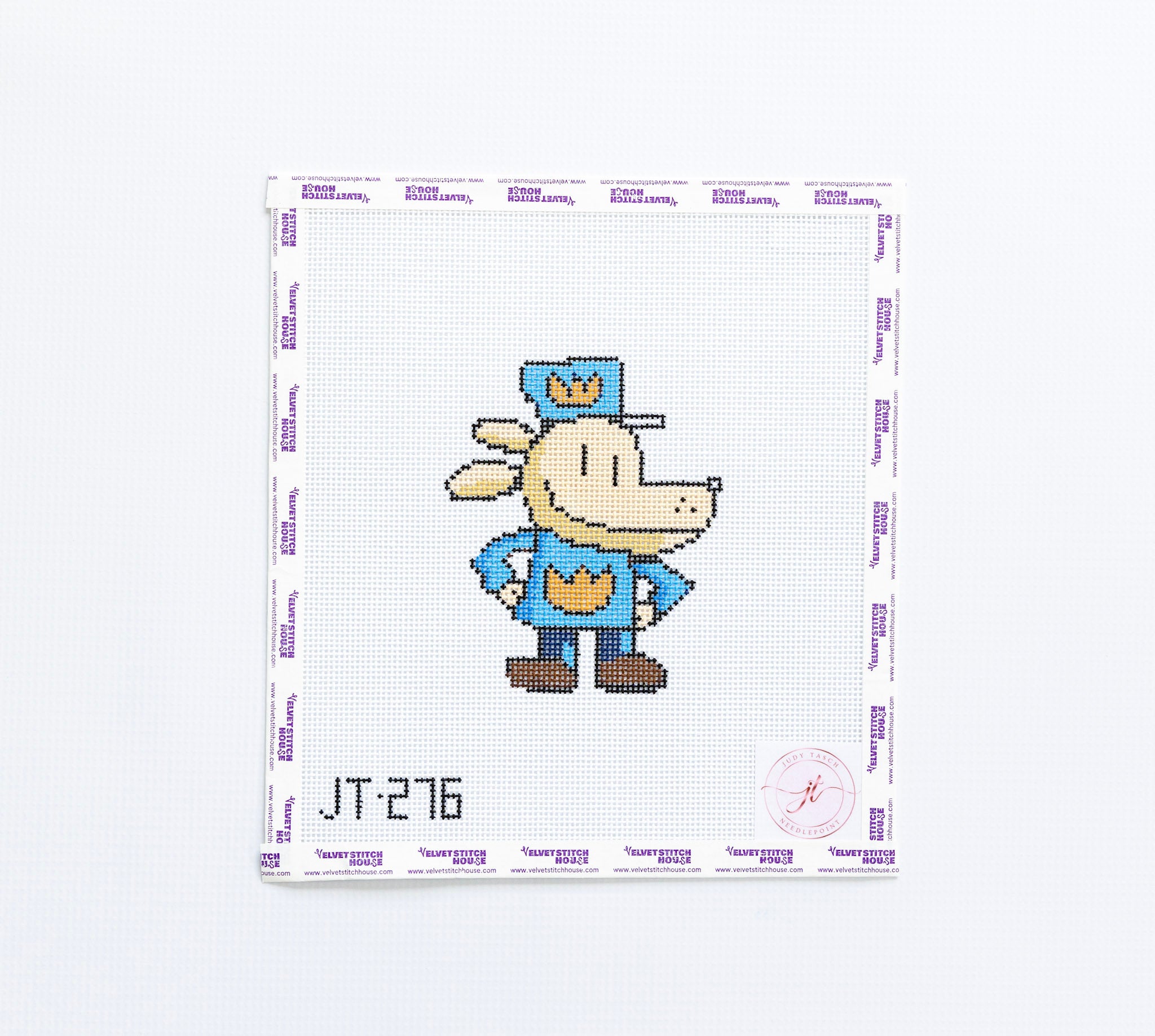 Needlepoint pattern of a cartoon dogman character on a white background