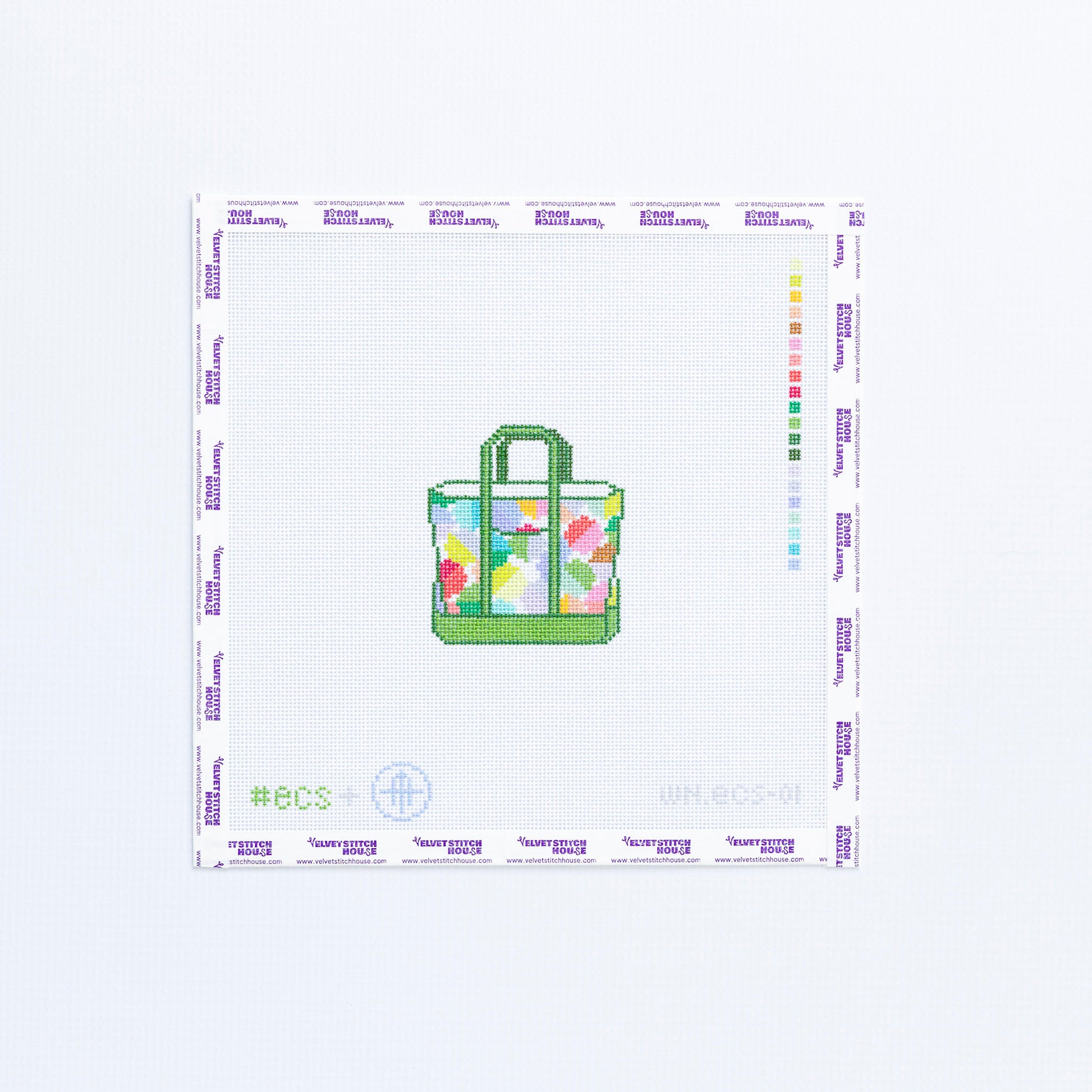 Needlepoint design of a geometric tote bag in mulit colors with green trim