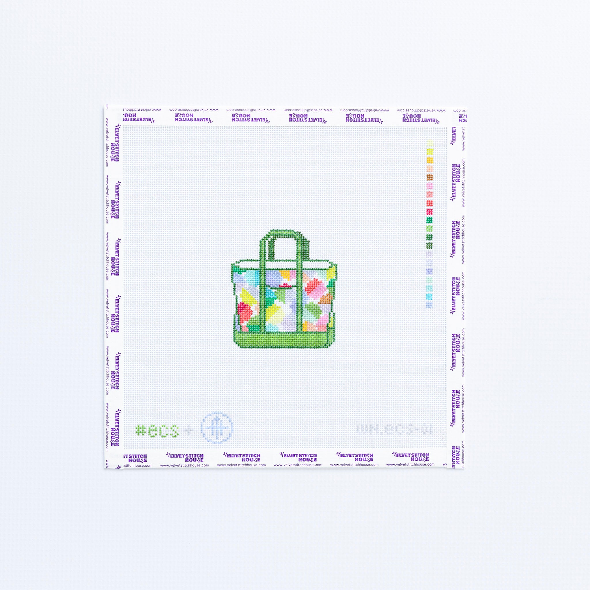 Needlepoint design of a geometric tote bag in mulit colors with green trim