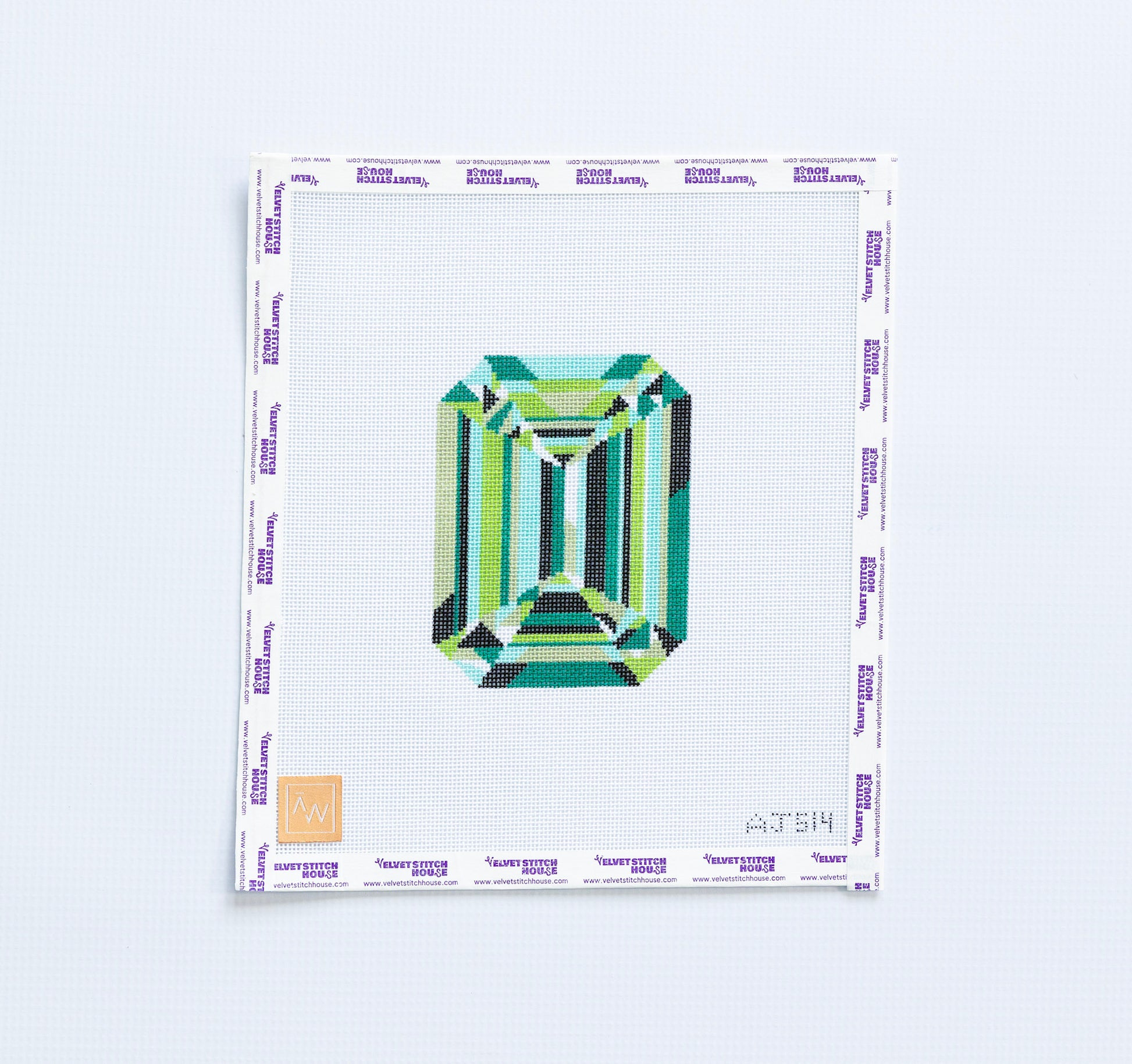 needlepoint pattern of a multi-Green emerald cut gemstone on a white background