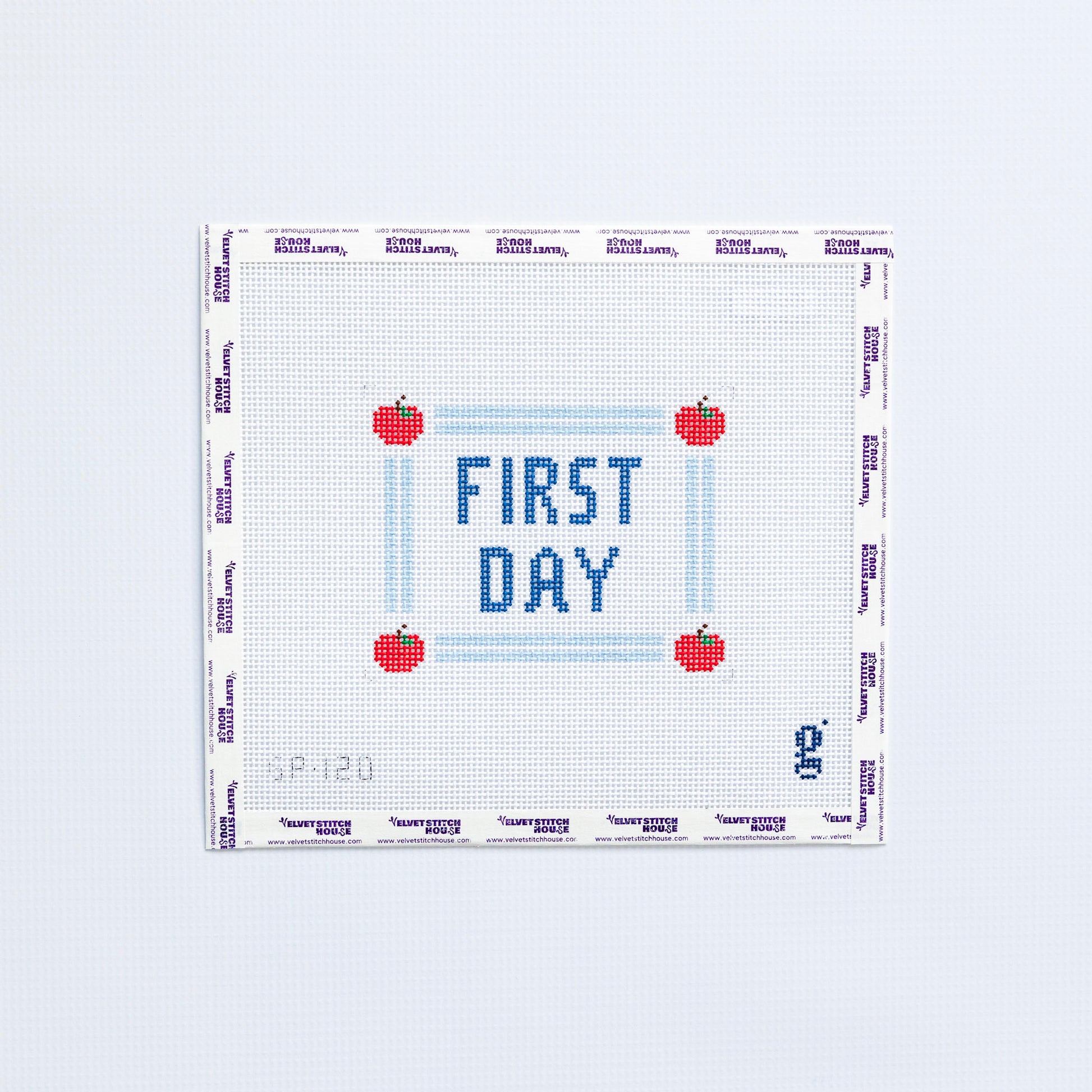 Needlepoint pattern with 'First Day' text and red apples on a white background