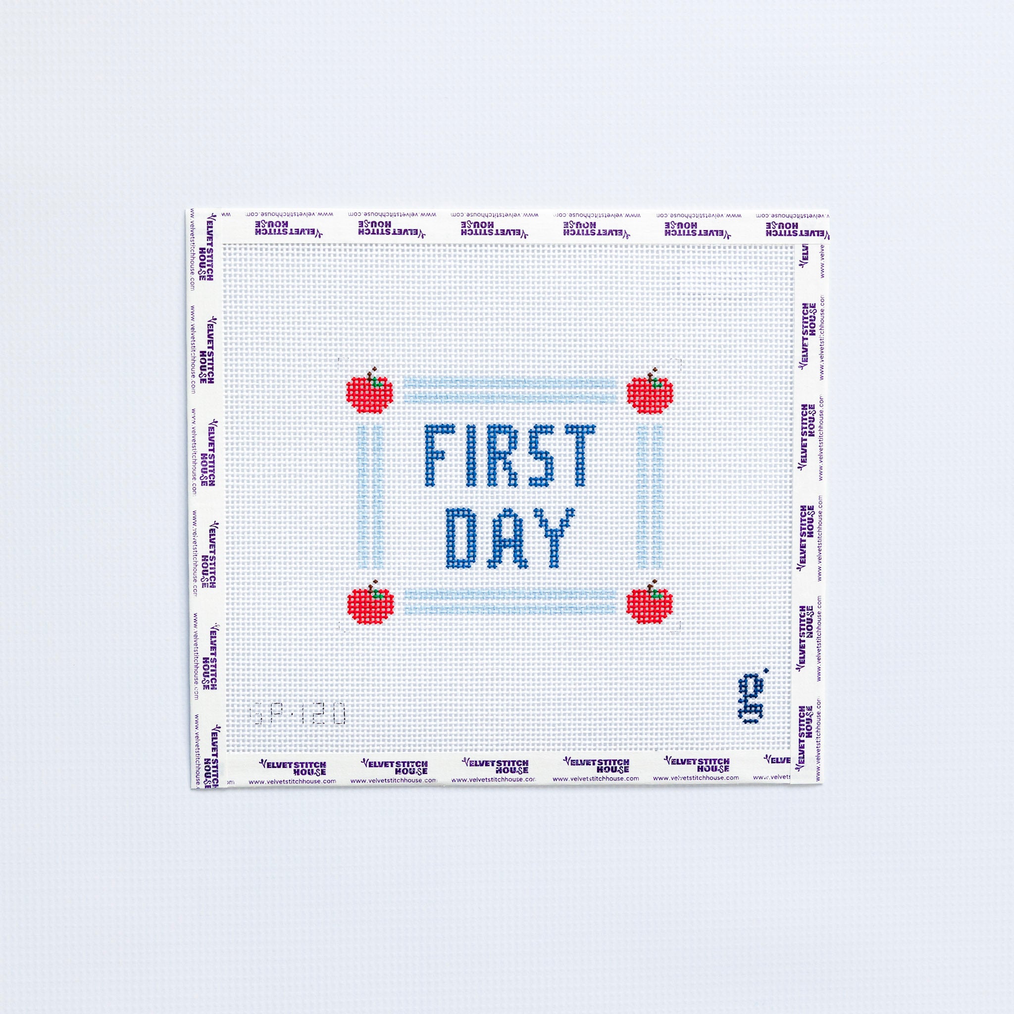 Needlepoint pattern with 'First Day' text and red apples on a white background