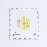 Needlepoint round design with pink flamingos and green striped background