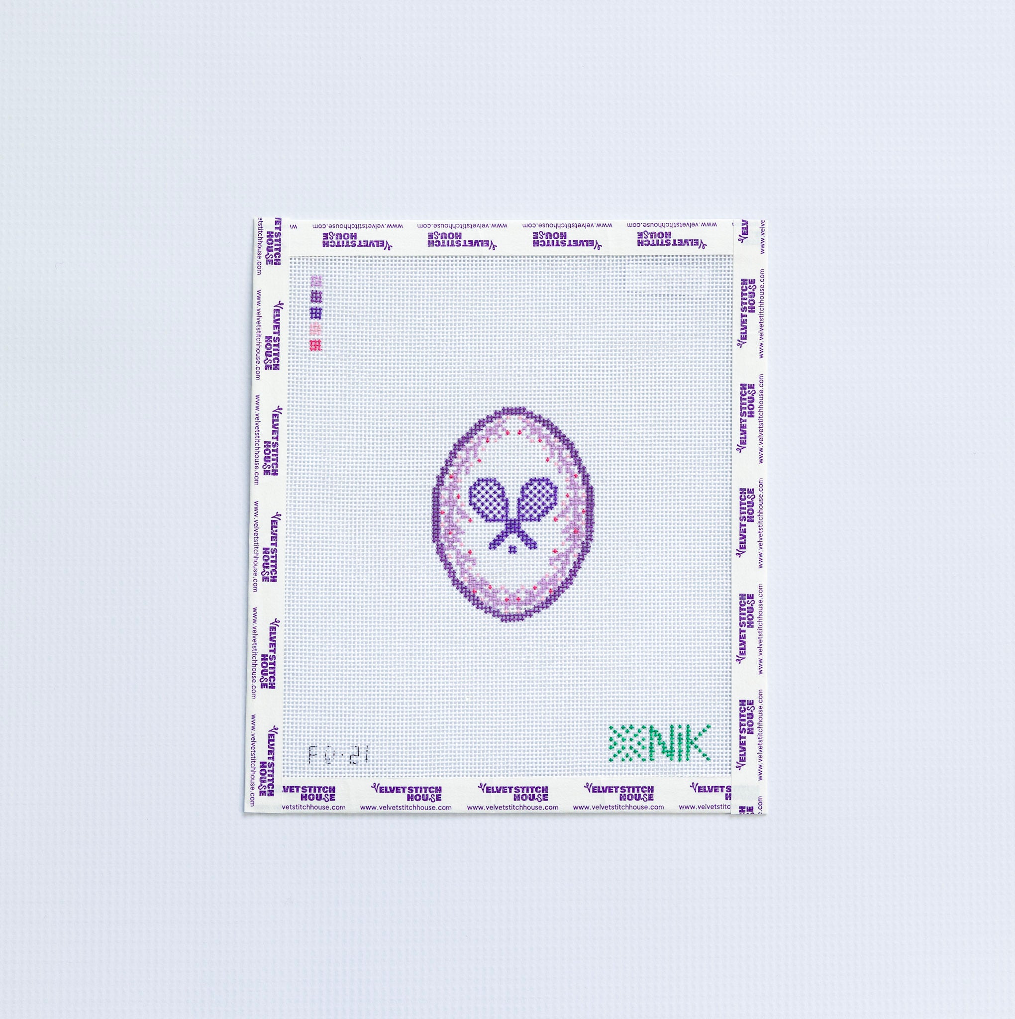 Needlepoint design of a tennis-themed logo and text in purple on a white background