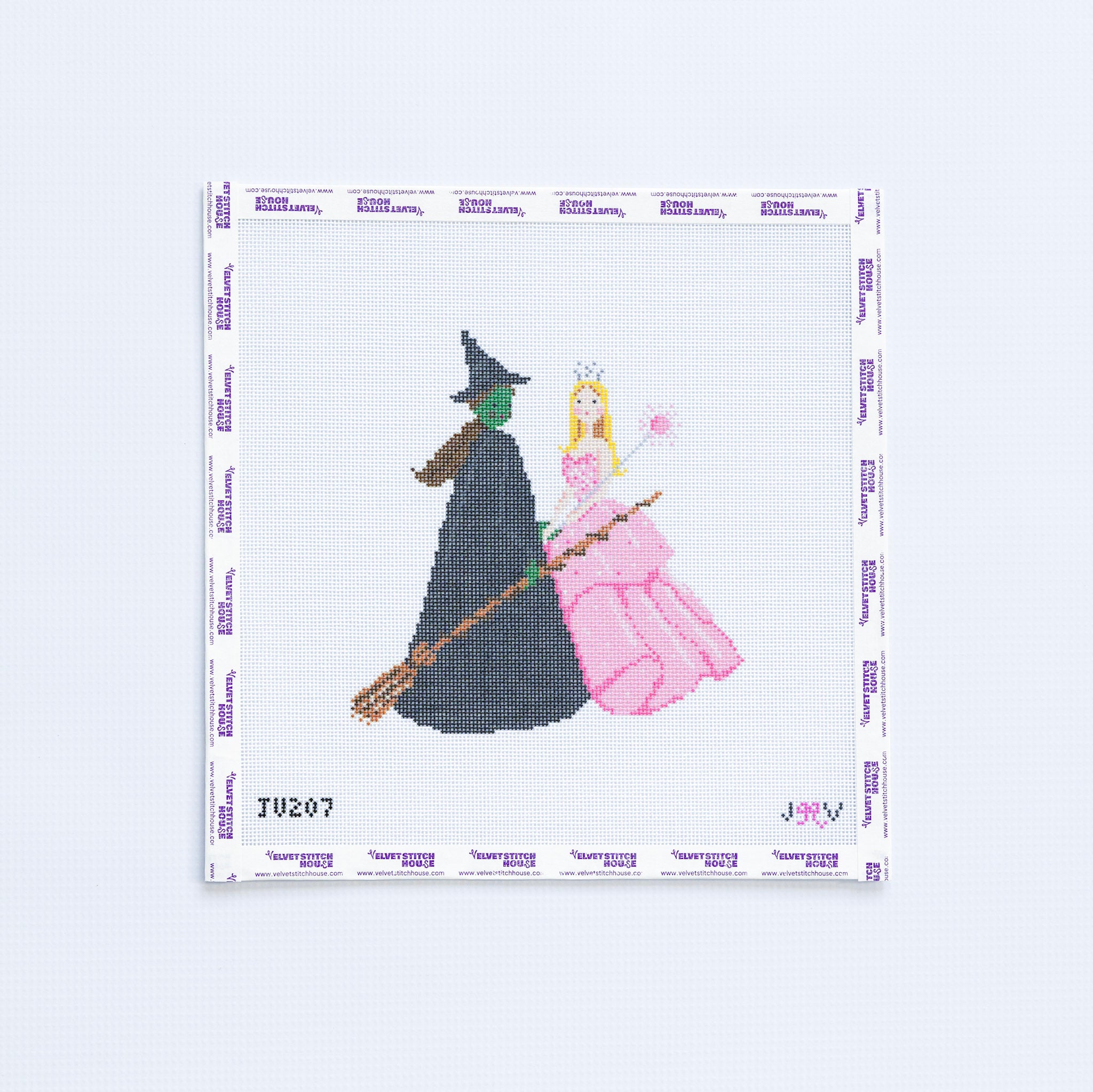 Needlepoint design of a witch and a princess in pink dress from wicked on a white background