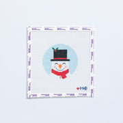 Needlepoint pattern round with Frosty the snowman with black top hat on a light blue background