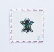 Needlepoint pattern of a black cat with  multicolored christmas lights 