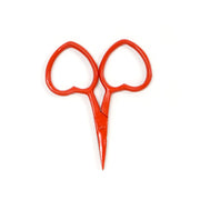 Mini Red scissors on a white background
