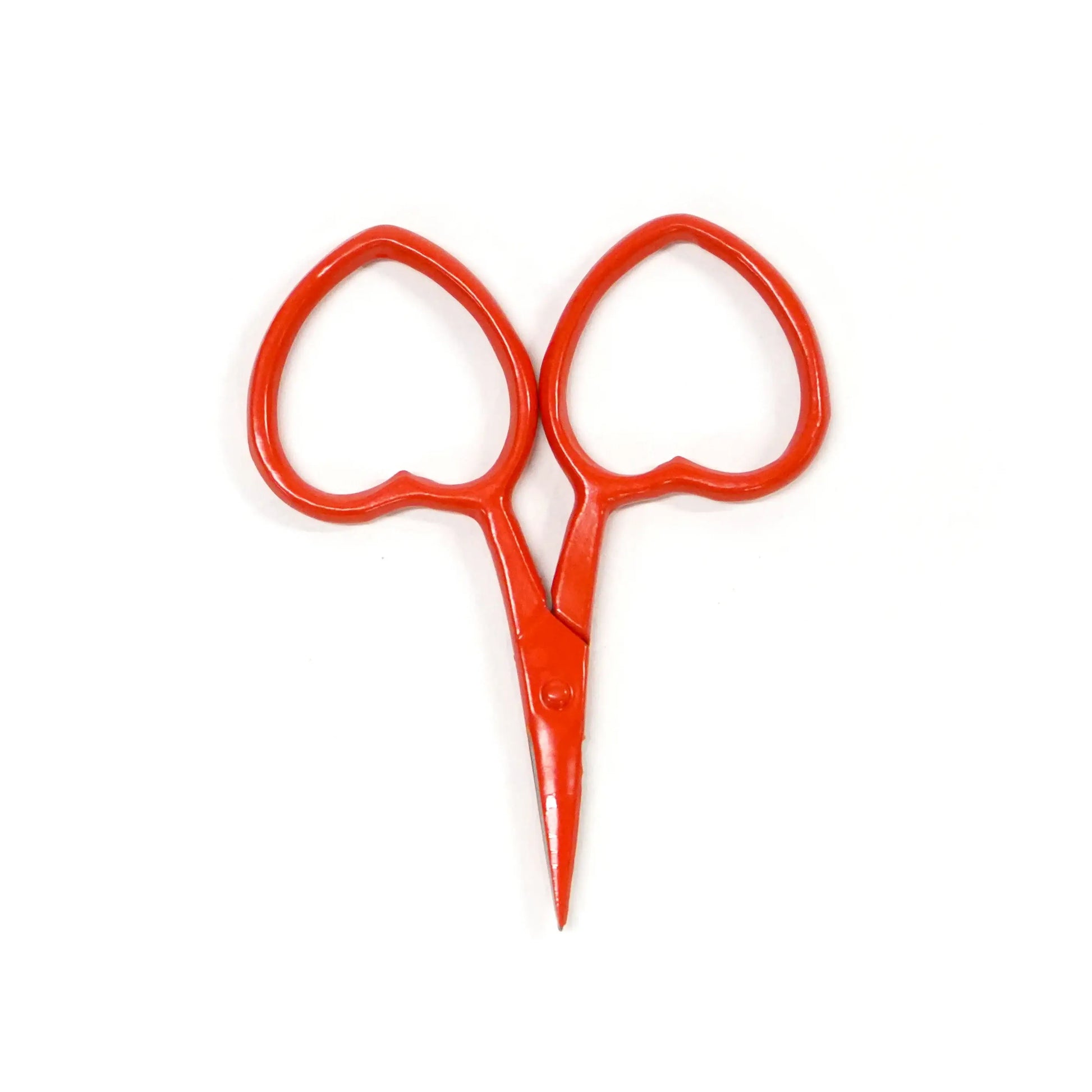 Mini Red scissors on a white background