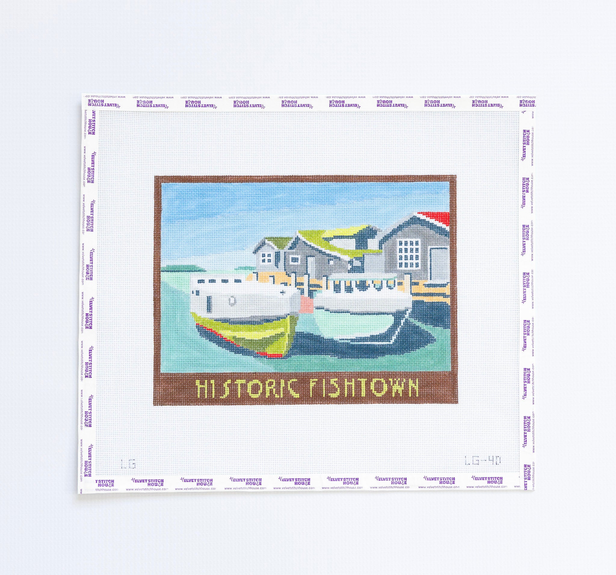 Needlepoint pattern of a coastal scene and with boats 'Historic Fishtown' text