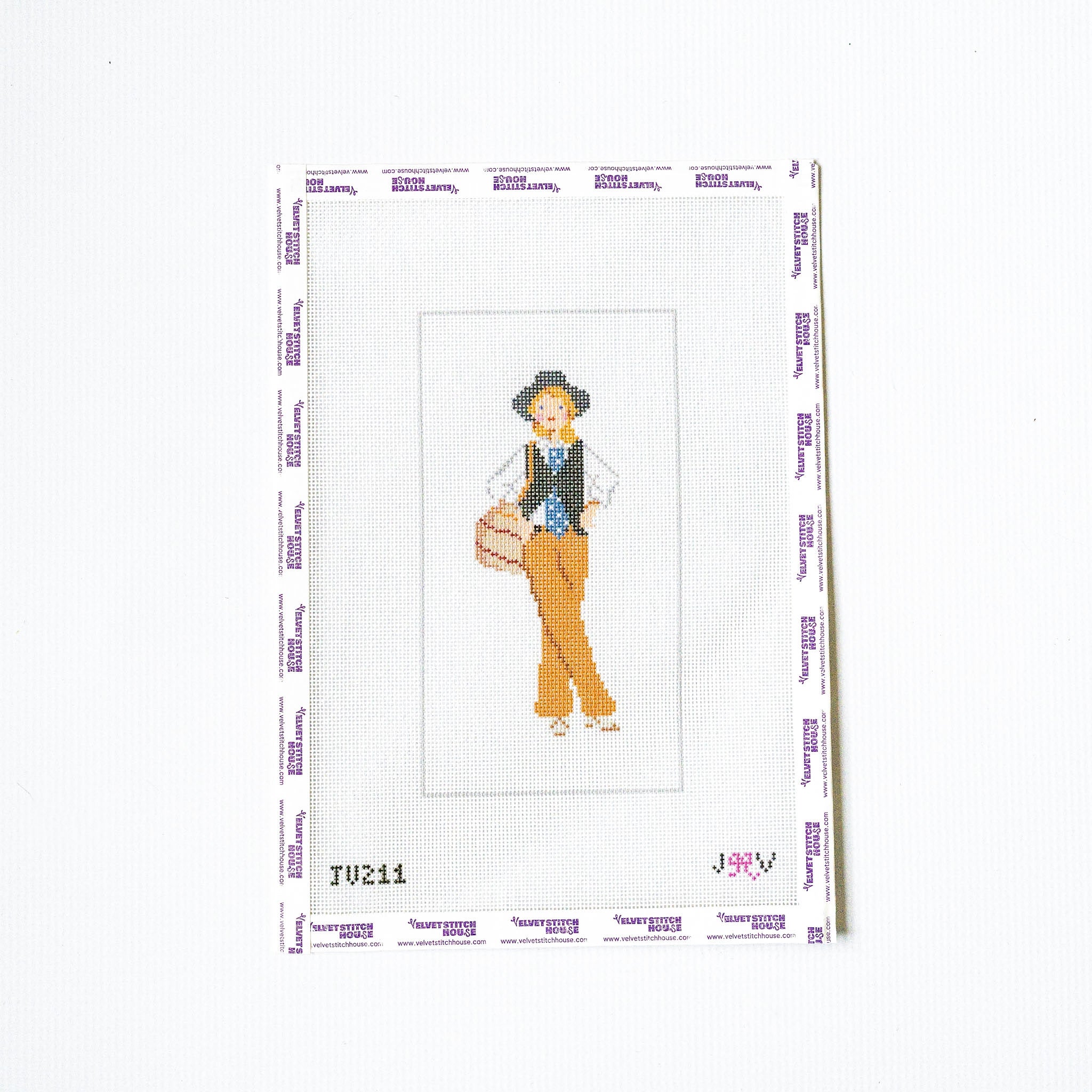 Needlepoint design of a person with a hat and vest on a white background