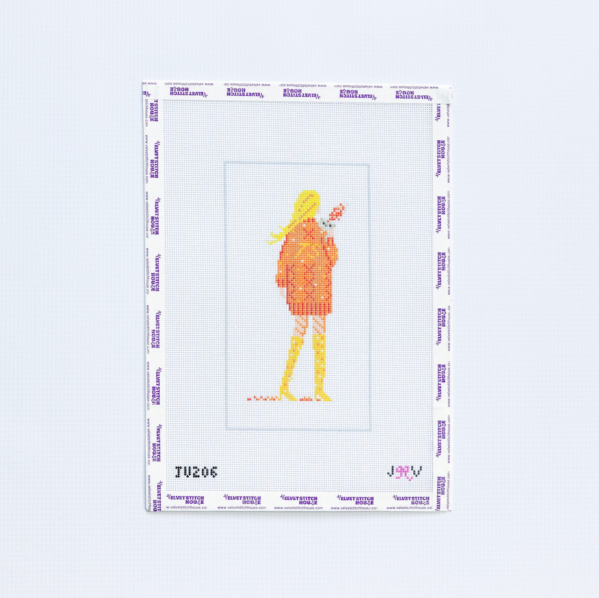 Needlepoint pattern with Taylor Swift image in an orange sweater on a white background