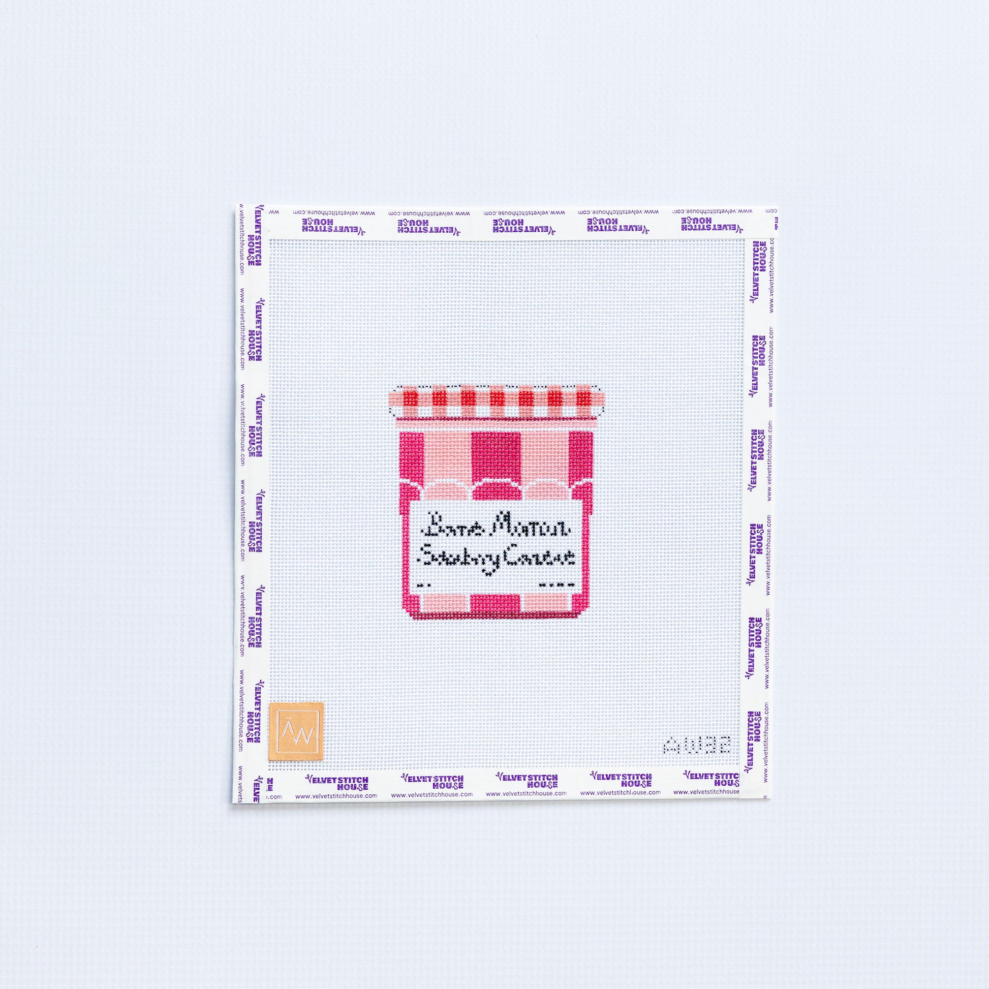 Needlepoint pattern with a jam Bonne Maman jar design in dark and light pink on a white background