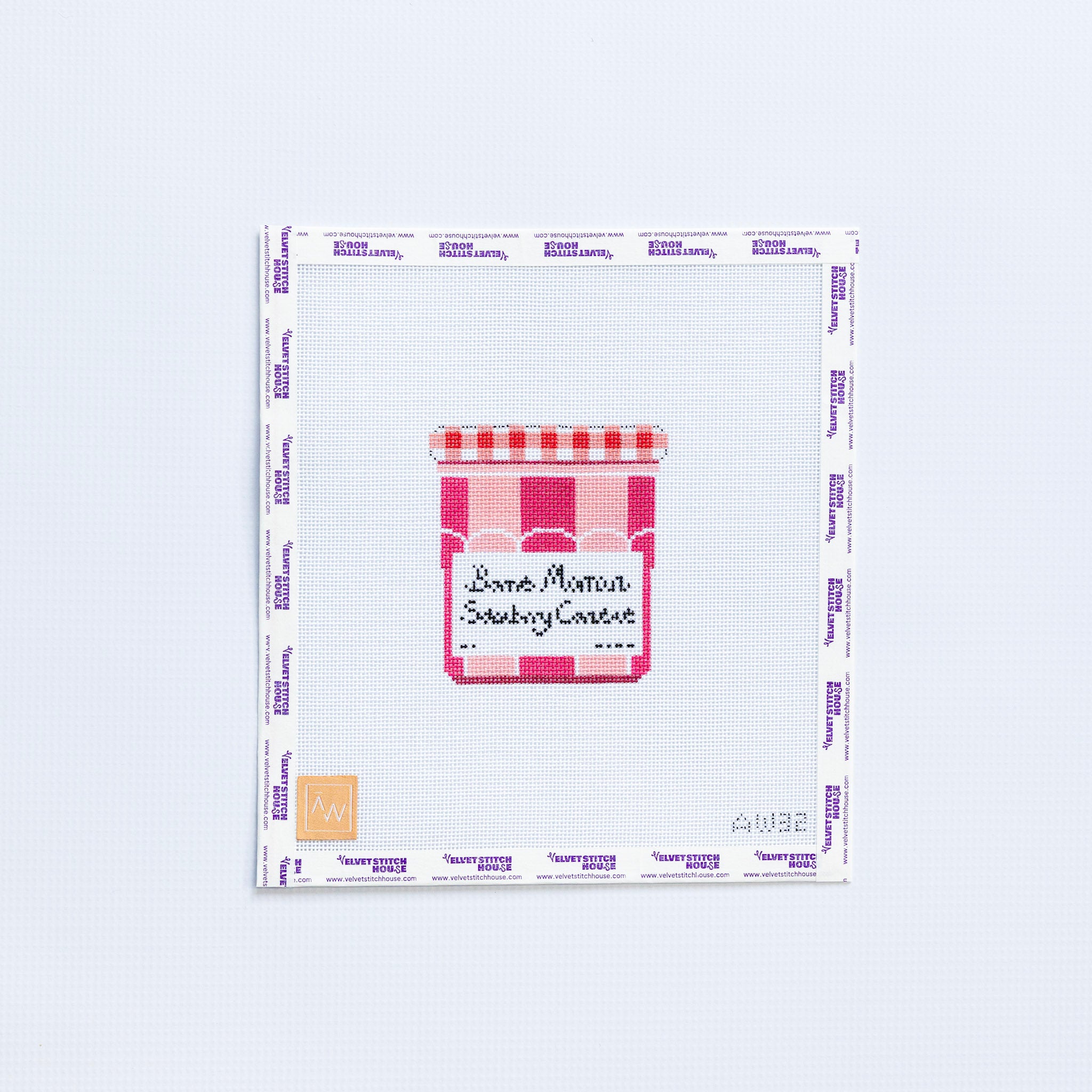 Needlepoint pattern with a jam Bonne Maman jar design in dark and light pink on a white background