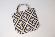 Fabric bag with geometric pattern on a white background
