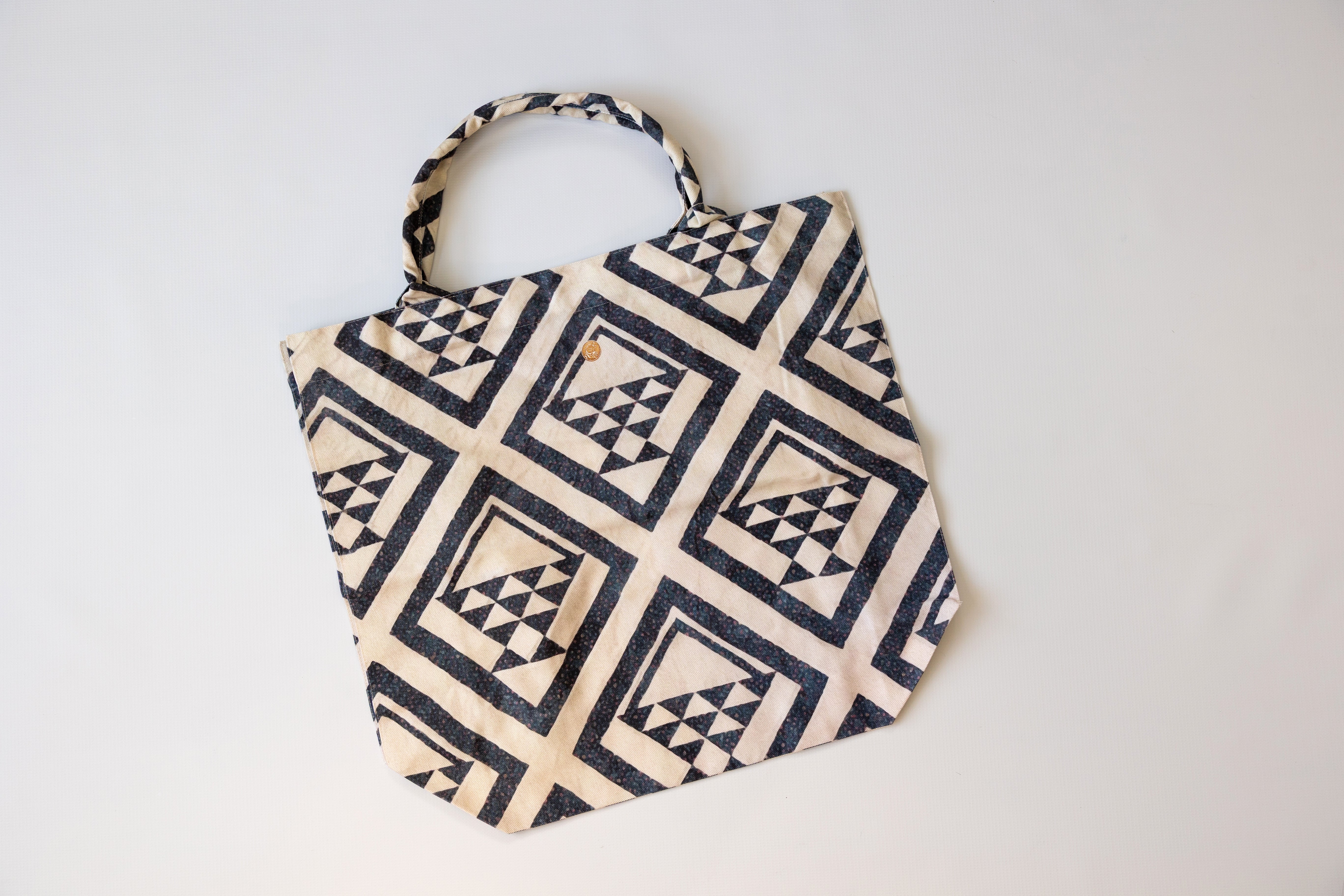 Fabric bag with geometric pattern on a white background