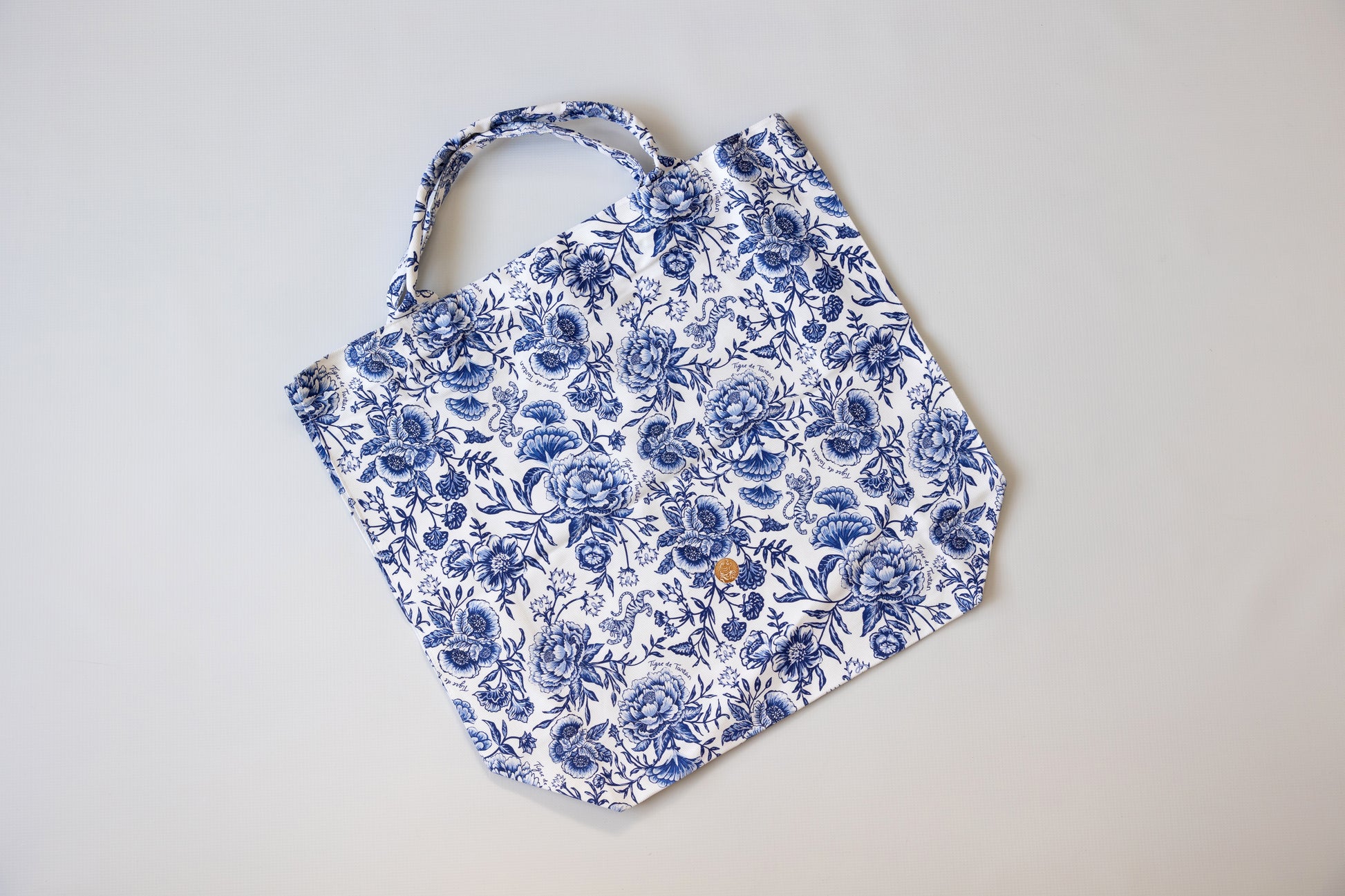Blue floral apron on a light gray background