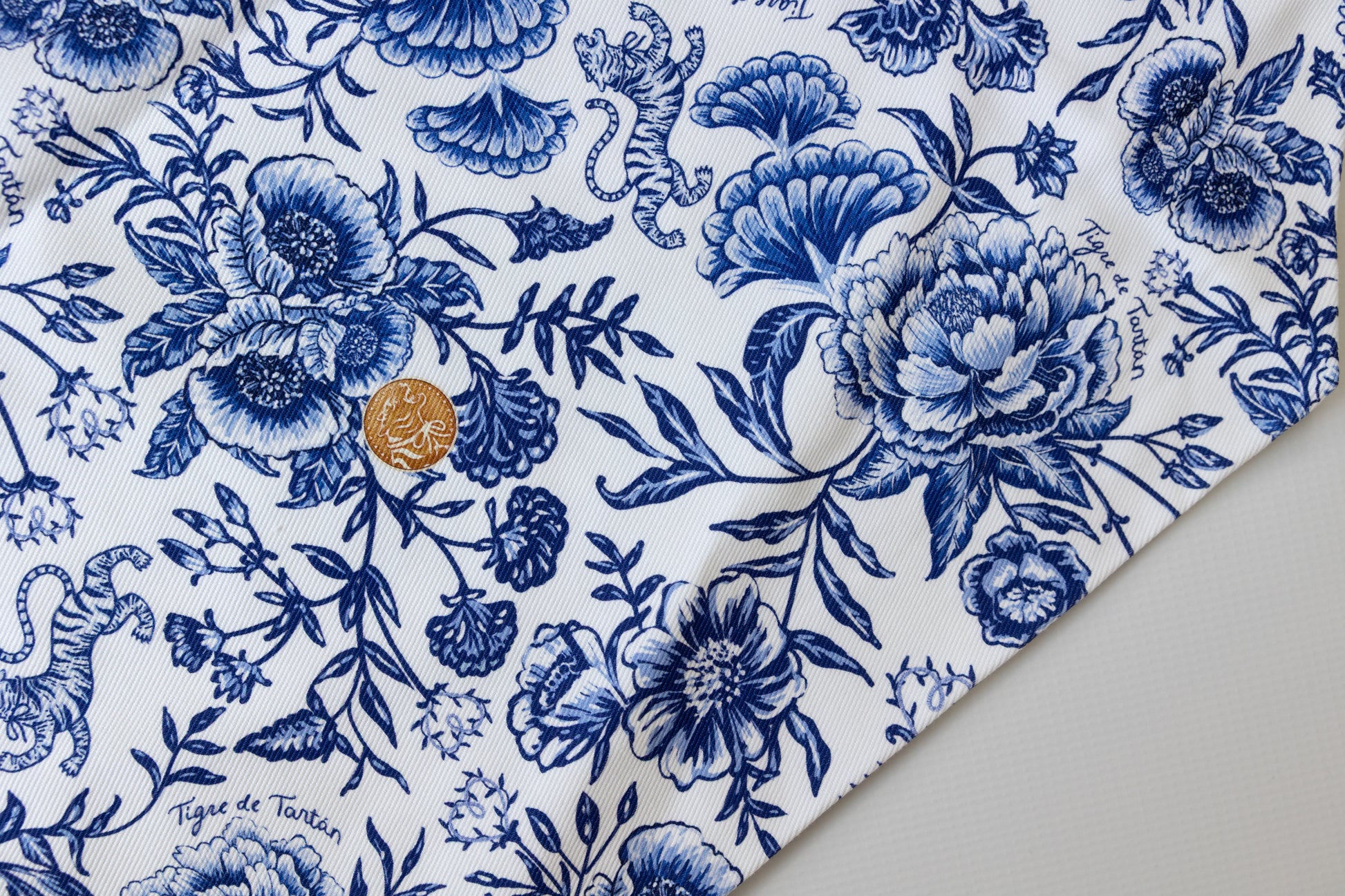 Blue floral and tiger pattern on a white background