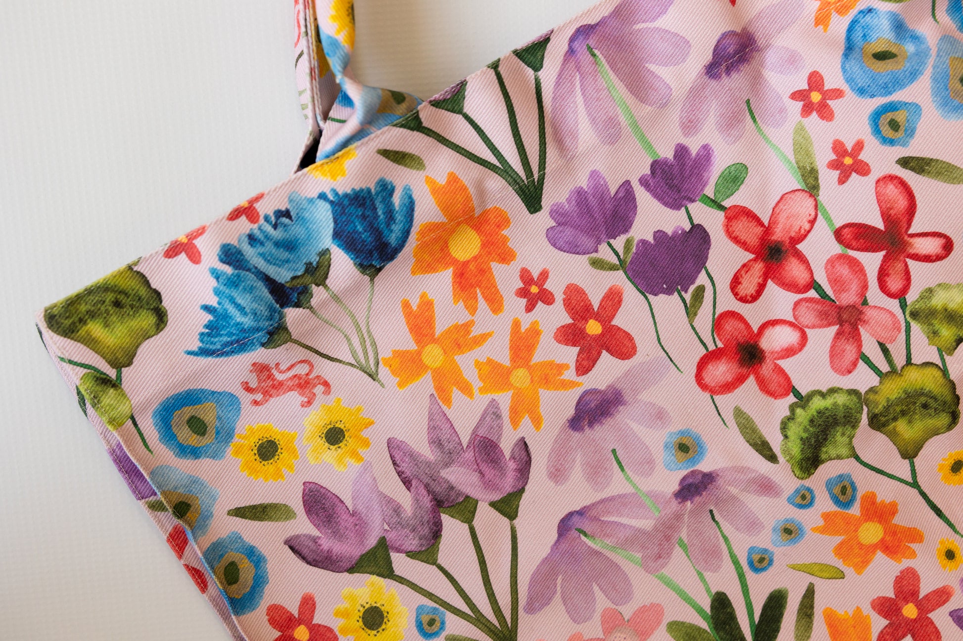 Floral-patterned fabric with colorful flowers on a white background