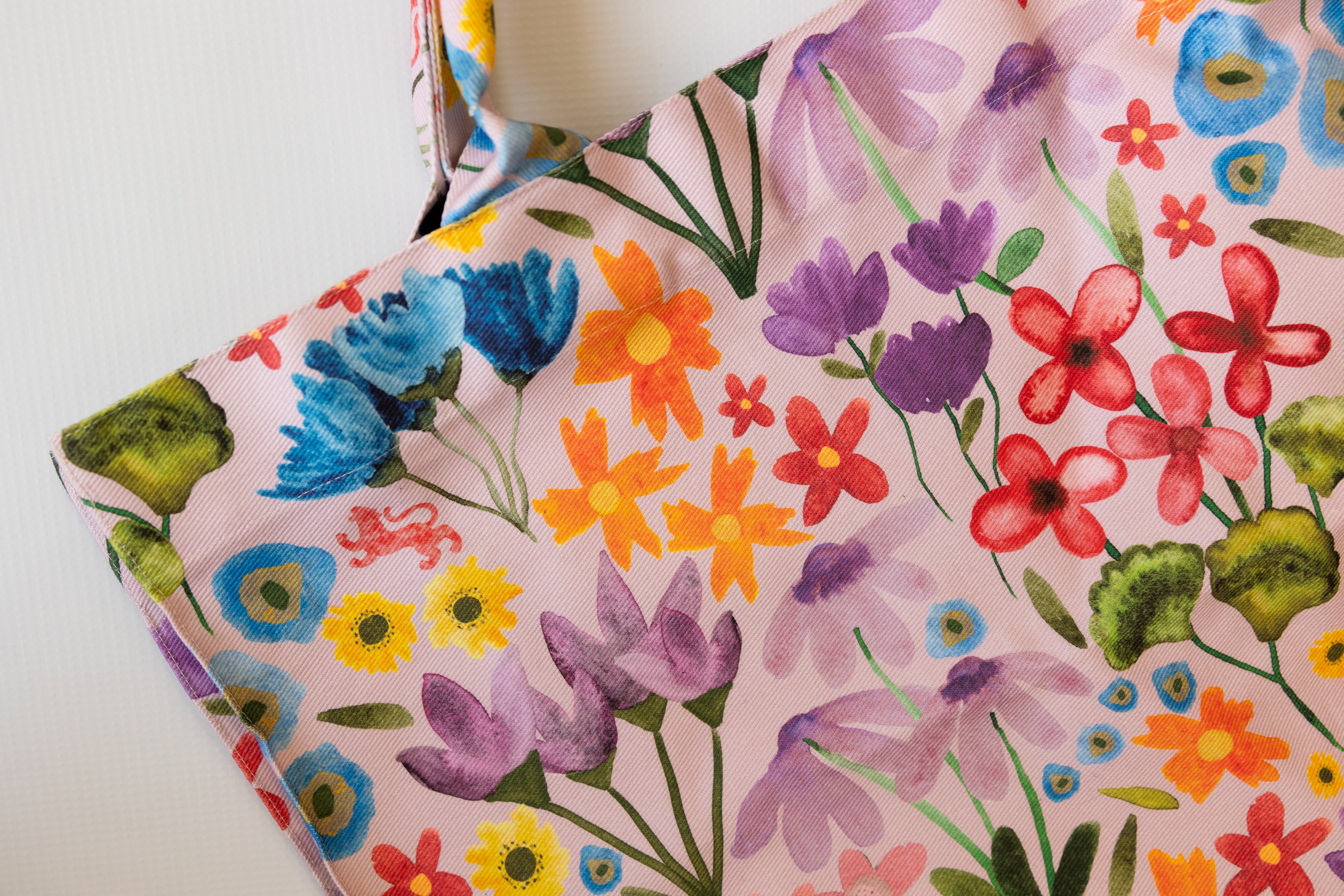 Floral-patterned fabric with colorful flowers on a white background