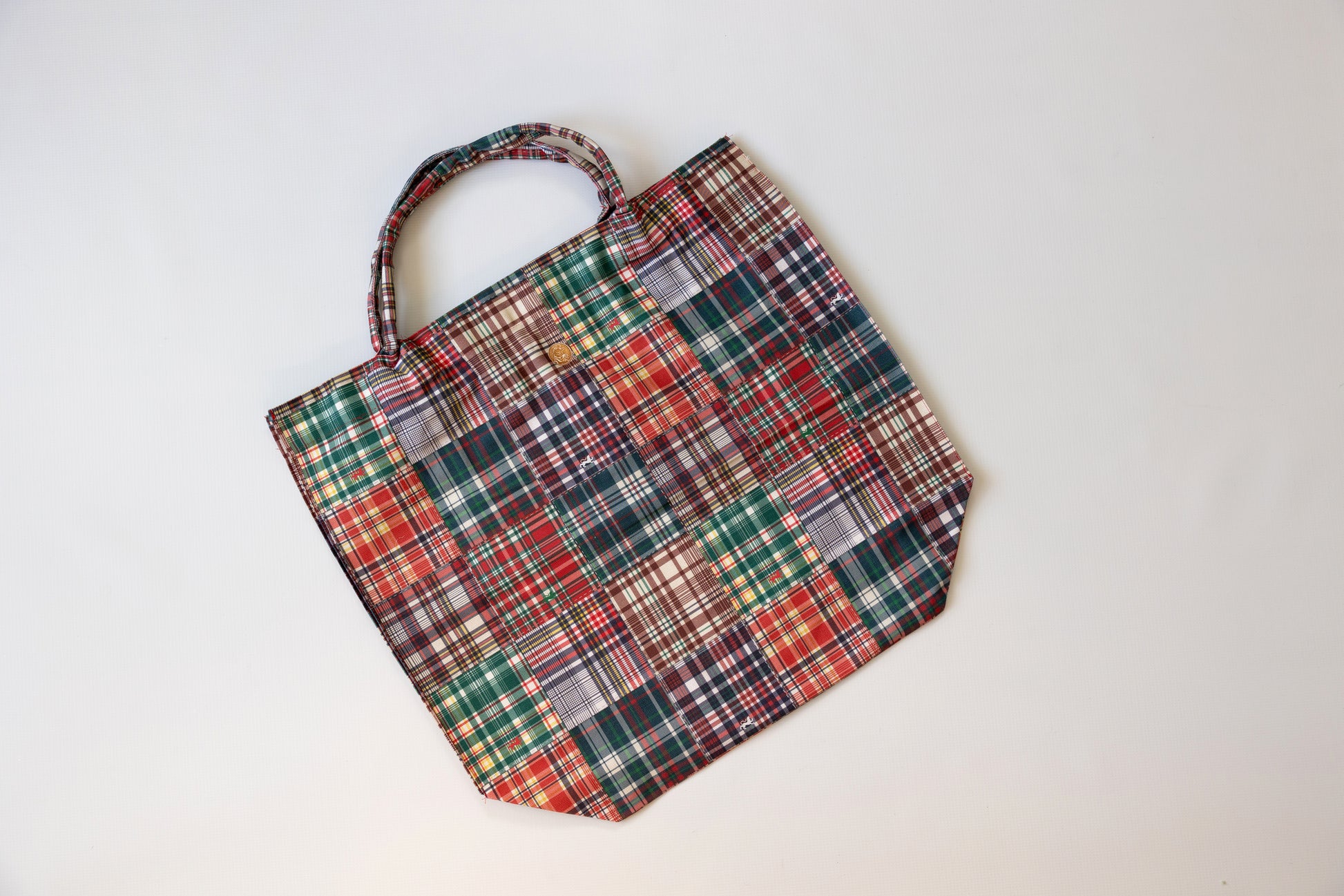 Plaid patterned tote bag on a white background